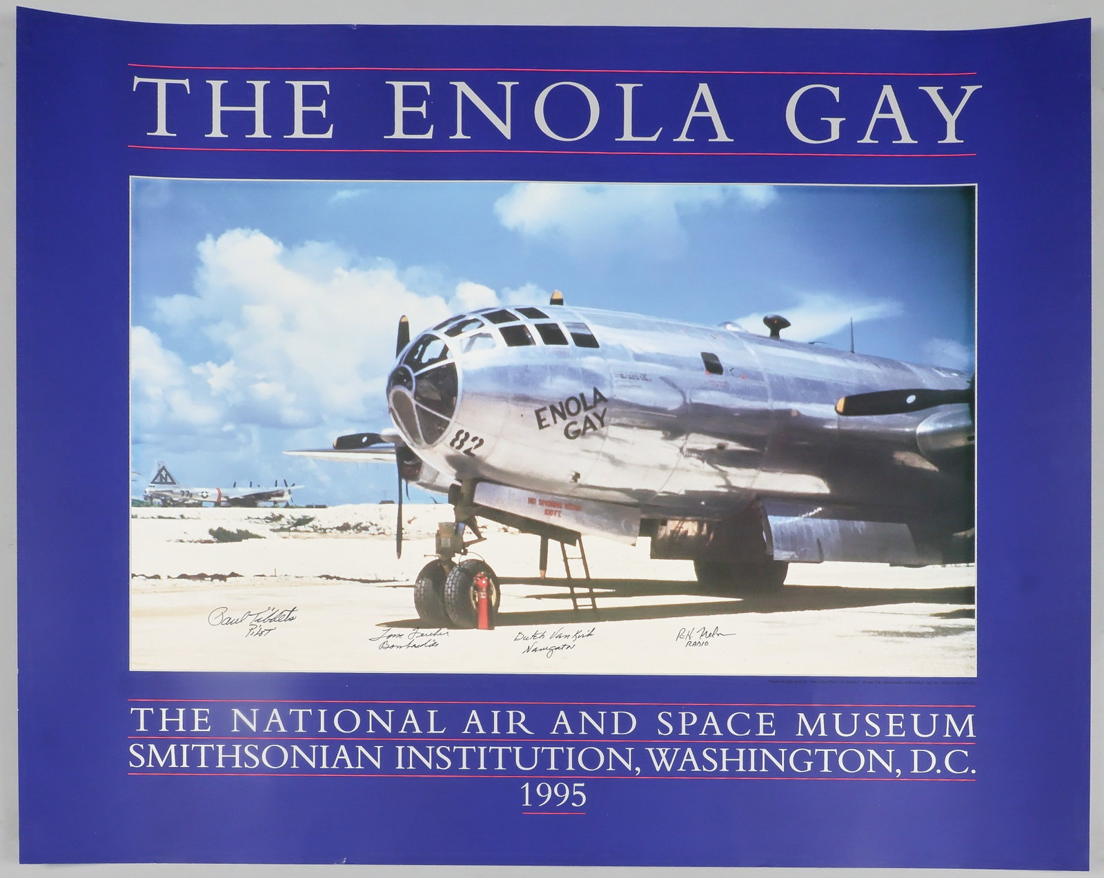 ENOLA GAY: Fine multi-signed poster, 30 x 24 in. color, a photograph of the front half of the famous aircraft as it rests upon the tarmac, probably at Tinian, issued in commemoration of the commencement of the d