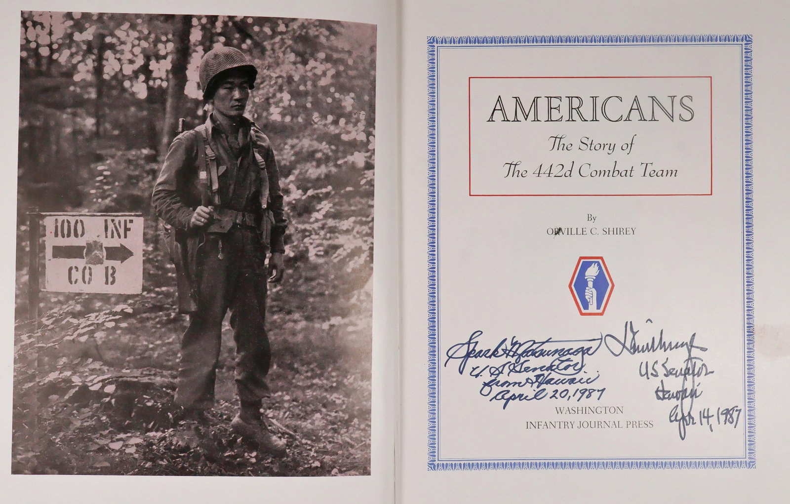 SIGNED HISTORY OF THE 442ND REGIMENTAL COMBAT TEAM: An extraordinary piece, a copy of the unit history of the 442nd Combat Team signed by two of its most illustrious members, Hawaii senators DANIEL K. INOUYE (1924-2012) and SPARK MATSUNAGA