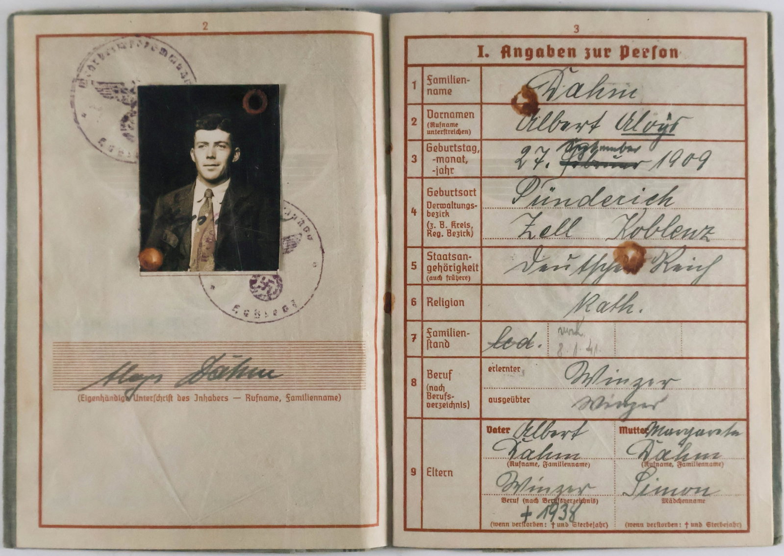 WEHRPASS FOR A FALLSCHIRMJAGER WHO FOUGHT IN NORMANDY: Excellent content German soldier's Luftwaffe wehrpass, issued to winemaker Albert Dahm of Koblenz, born in 1905. Dahm, eventually promoted to corporal, was drafted on Feb. 29, 1940. He first served