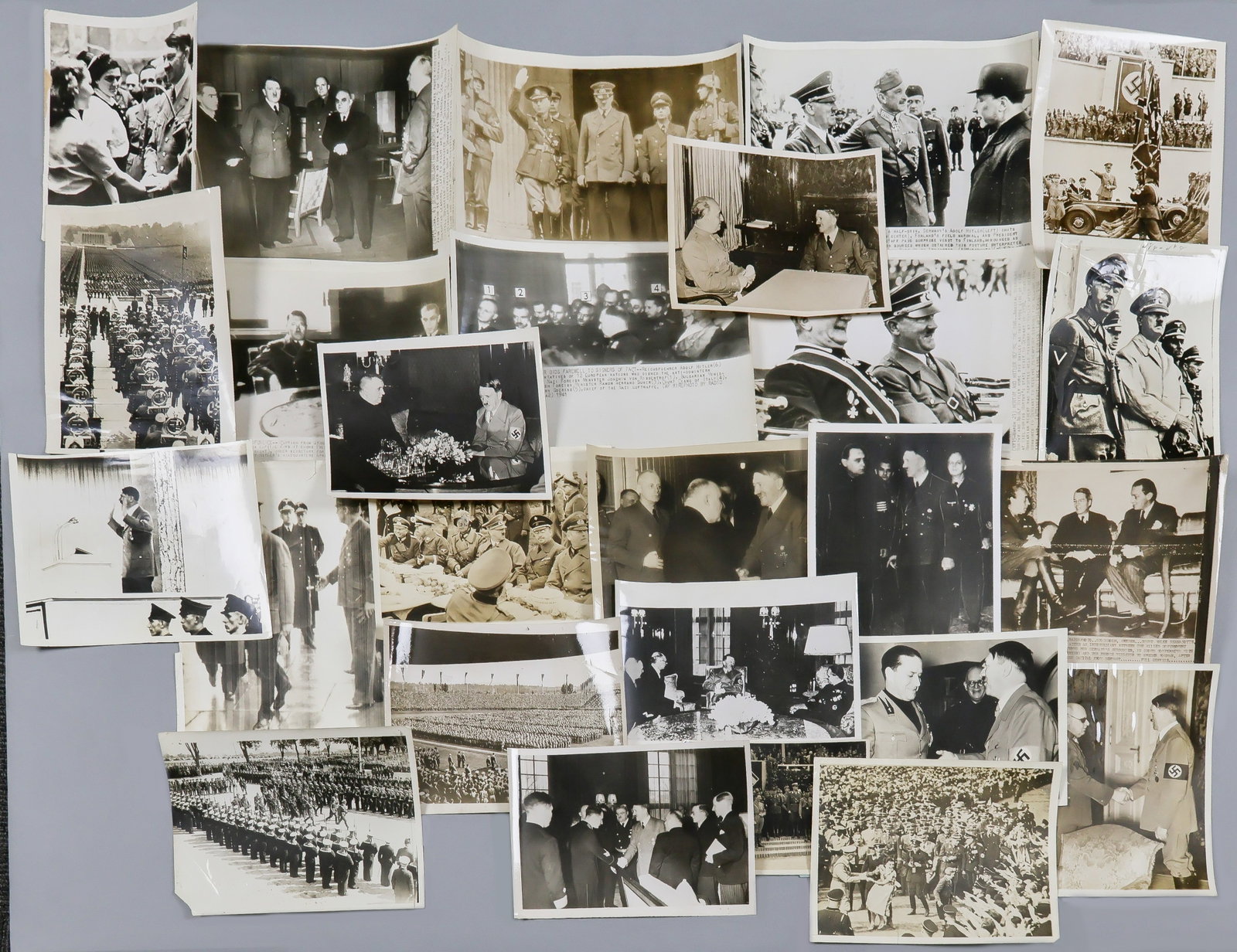 ADOLF HITLER (25): Good lot of 25 period press photographs, average size about 7 x 9 in. and the great majority with period date and/or press affiliation ink stamps on verso, a good representative selection of varying