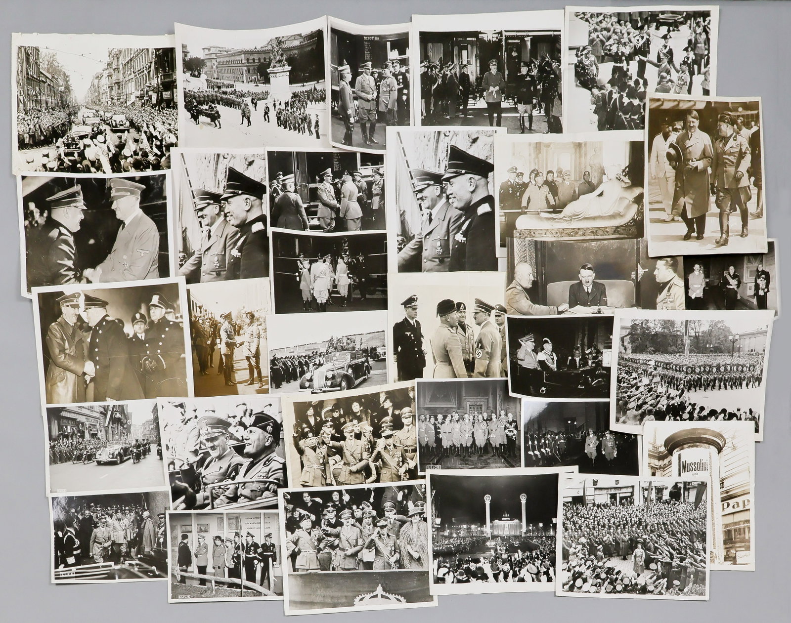 ADOLF HITLER AND BENITO MUSSOLINI MEETINGS (55): Excellent lot of 55 original, period press photographs, most issued by the Italian press agency 'LUCE', others from U.S. press outlets, most 5 x 7 in. and larger, alternately showing Hitler arriving