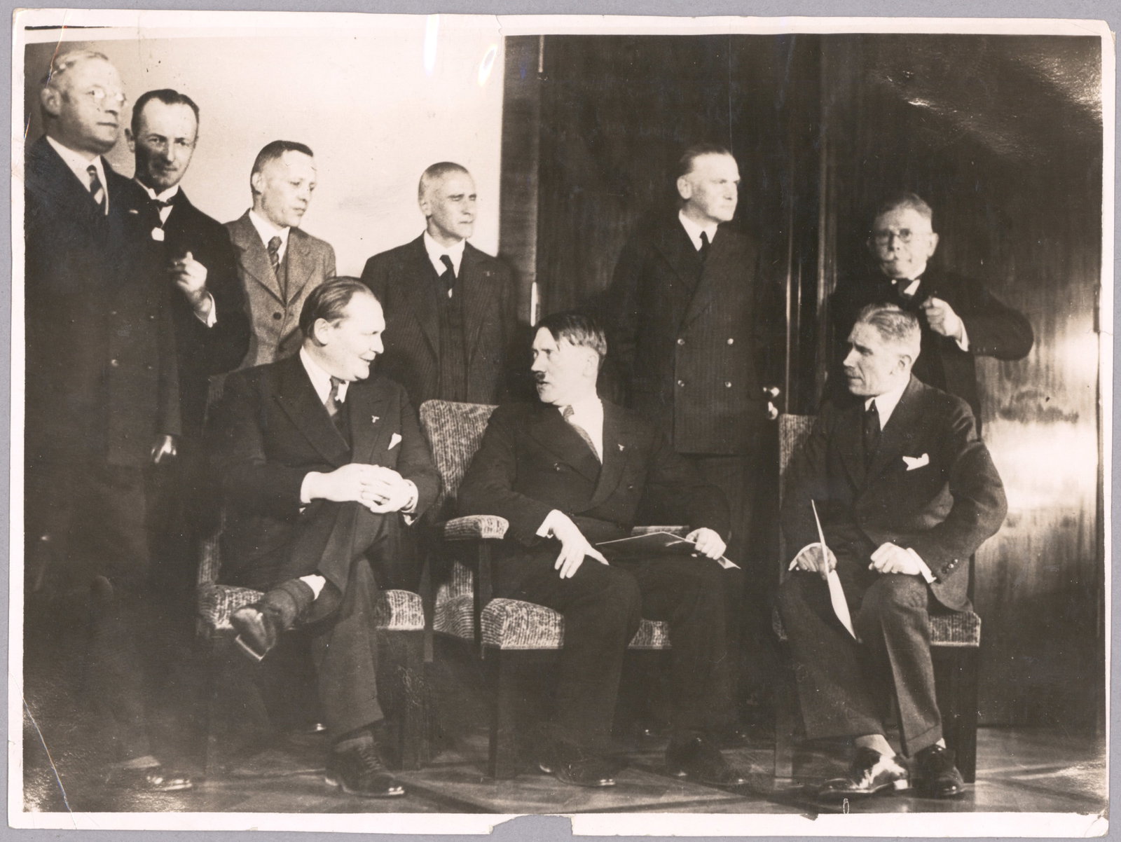 ADOLF HITLER PRESS PHOTOS (3): A group of three original German press photos: the first 7 x 9 in., shows Hitler with a group of disabled veterans on Unter den Linden, March 12, 1939. WITH: a photograph, 9.5 x 7 in., Feb. 8, 1933,
