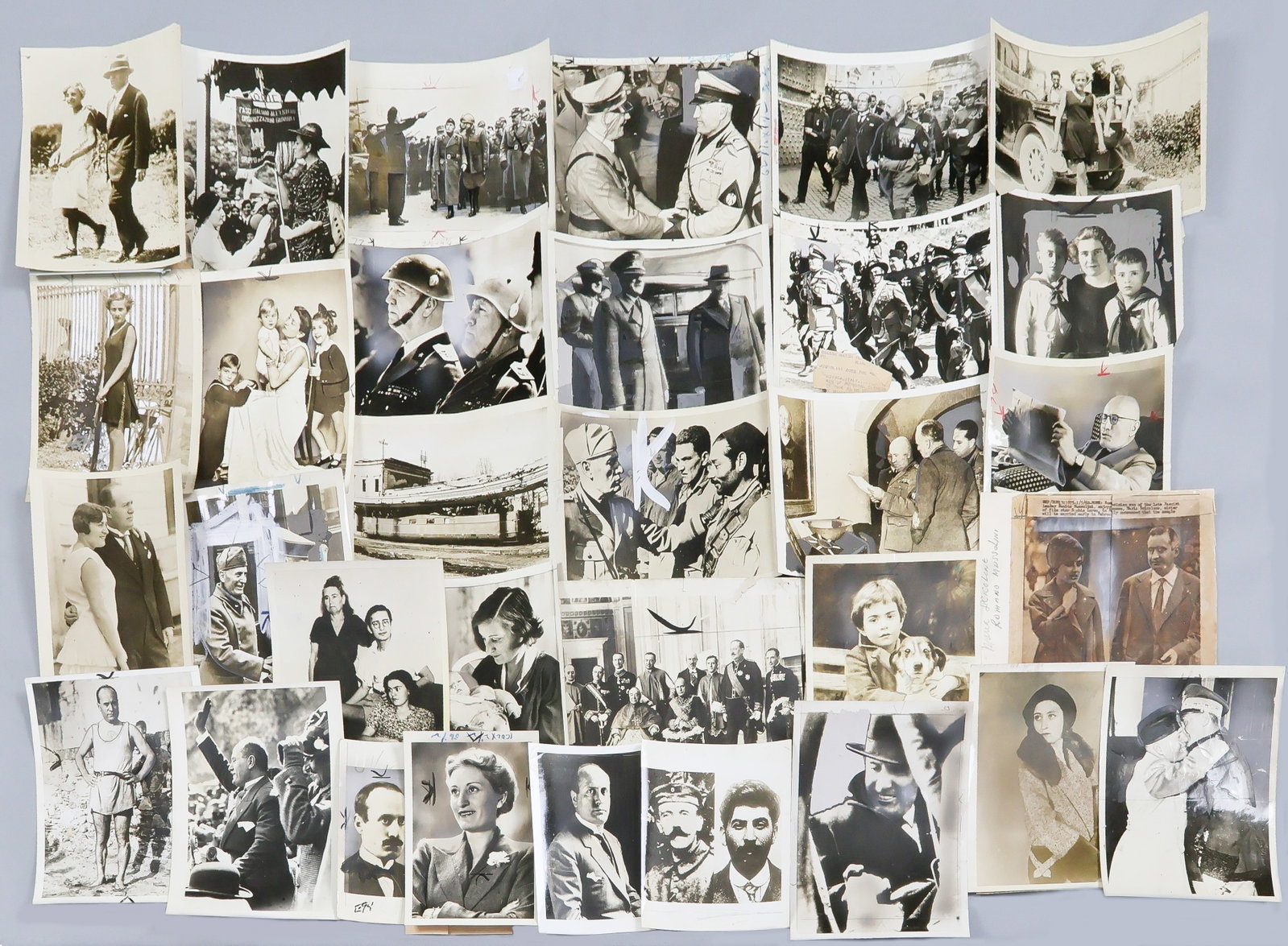 BENITO MUSSOLINI AND FAMILY (50+): Good lot of over fifty original period press photographs of Mussolini from throughout his political career, about half of the images depicting his mother, wife, and children at various ages. Some phot