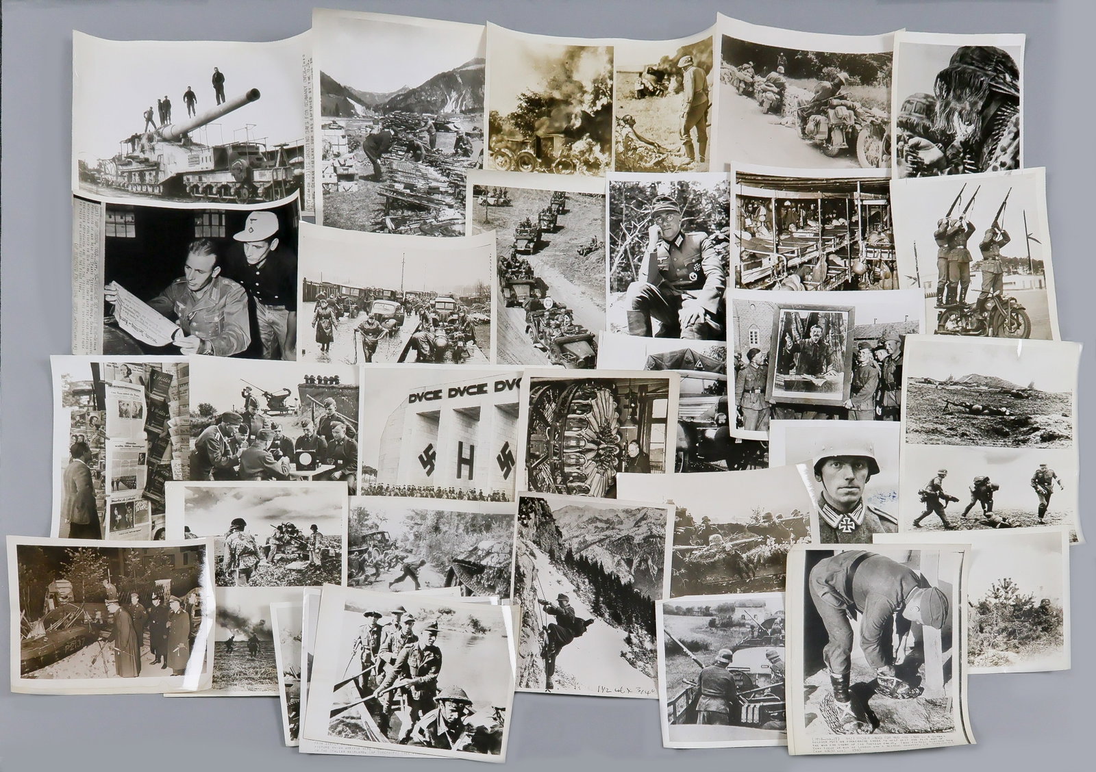 GERMAN MILITARY PHOTOGRAPHS (31): Good lot of 31 original World War II American press photographs, most 8 x 10 in., various German military scenes with several showing members of the SS. Most bear ink and date stamps with printed capt