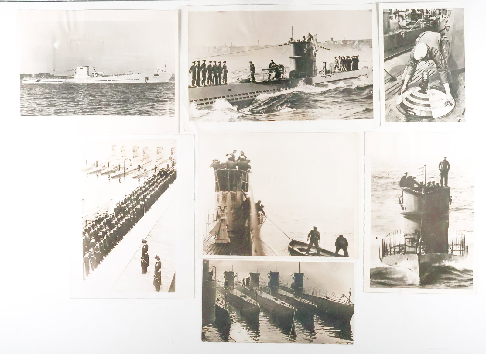 GERMAN U-BOAT PRESS PHOTOGRAPHS (23): Good lot of 23 original, period American press photographs of German U-boats, the images capturing the ships at sea, their crews in various poses, interior views, send-offs, etc. Almost all are