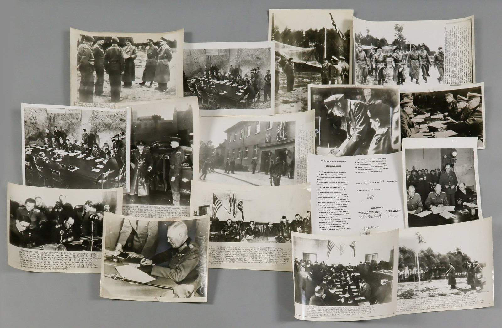GERMANS SURENDER AT REIMS AND BERLIN (15): Lot of 15 original, period American-issue press photographs, all 8 x 10 in. or larger, showing events leading up to and including the German surrenders at Reims, May 5, 1945 and Berlin, May 8, 1945,