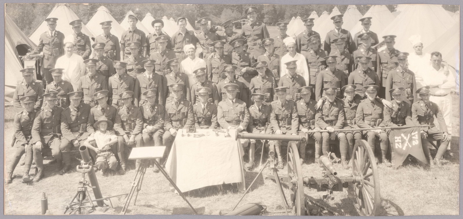 'GOOFBALLS ON DISPLAY': Great unit photograph of what appears to be squad of men, perhaps members of the 172nd Infantry Brigade as suggested by the guidon at right, but an informal image screwed-up by multiple jokers in the