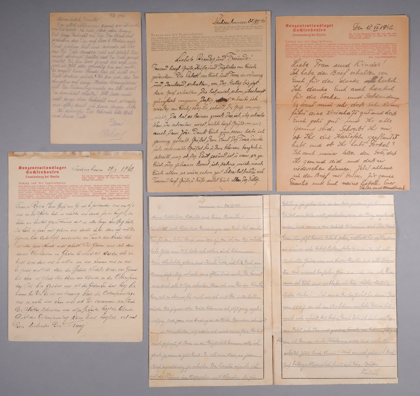 CONCENTRATION CAMP LETTER GROUP (5): Five letters dated from 1942-1943: one from Mauthausen, three from Sachsenhausen, and a postcard from the Theresienstadt Ghetto, all on respective letterheads. Each letter bears the usual, comforting 