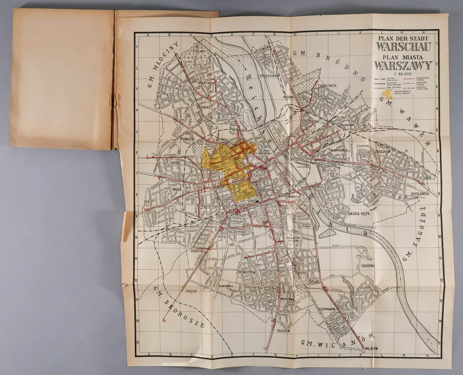 GERMAN MAP OF THE JEWISH WARSAW GHETTO: Chilling map showing the city of Warsaw, Poland in 1942, 15.5 x 16 in., printed in Polish and German. The map bears a large, distinct yellow-tinted area west of the Vistula which the map has labeled '