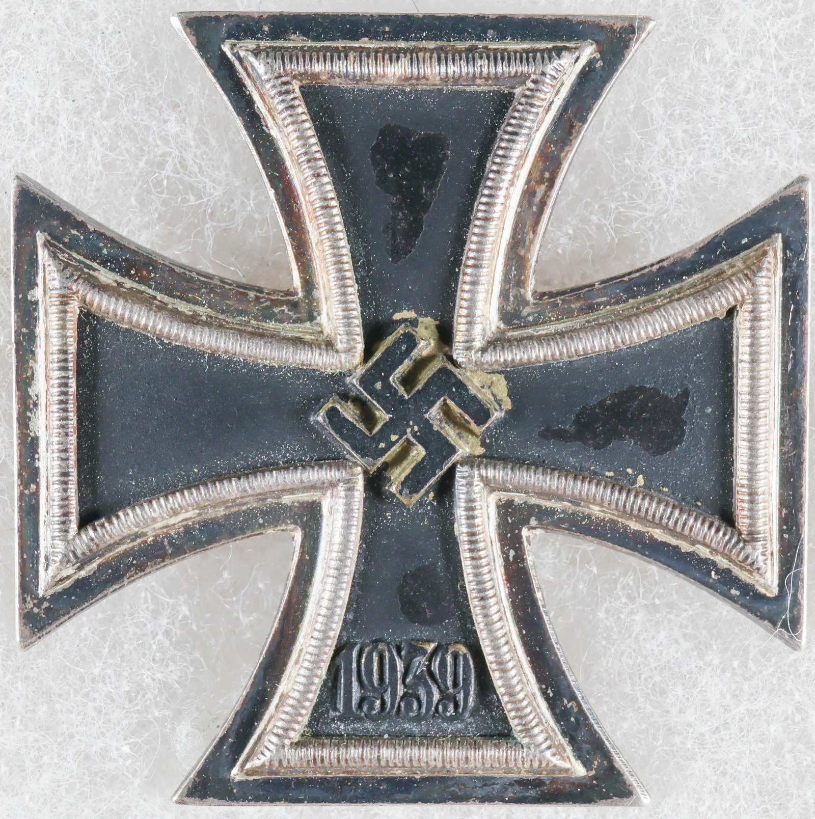 IRON CROSS, FIRST CLASS BY WACHTLER & LANGE: Pin-back medal, approx. 1.75 in. square, an Iron Cross, First Class bearing the date ‘1939’ beneath a mobile swastika on the face, indicating that it was issued during World War II. The