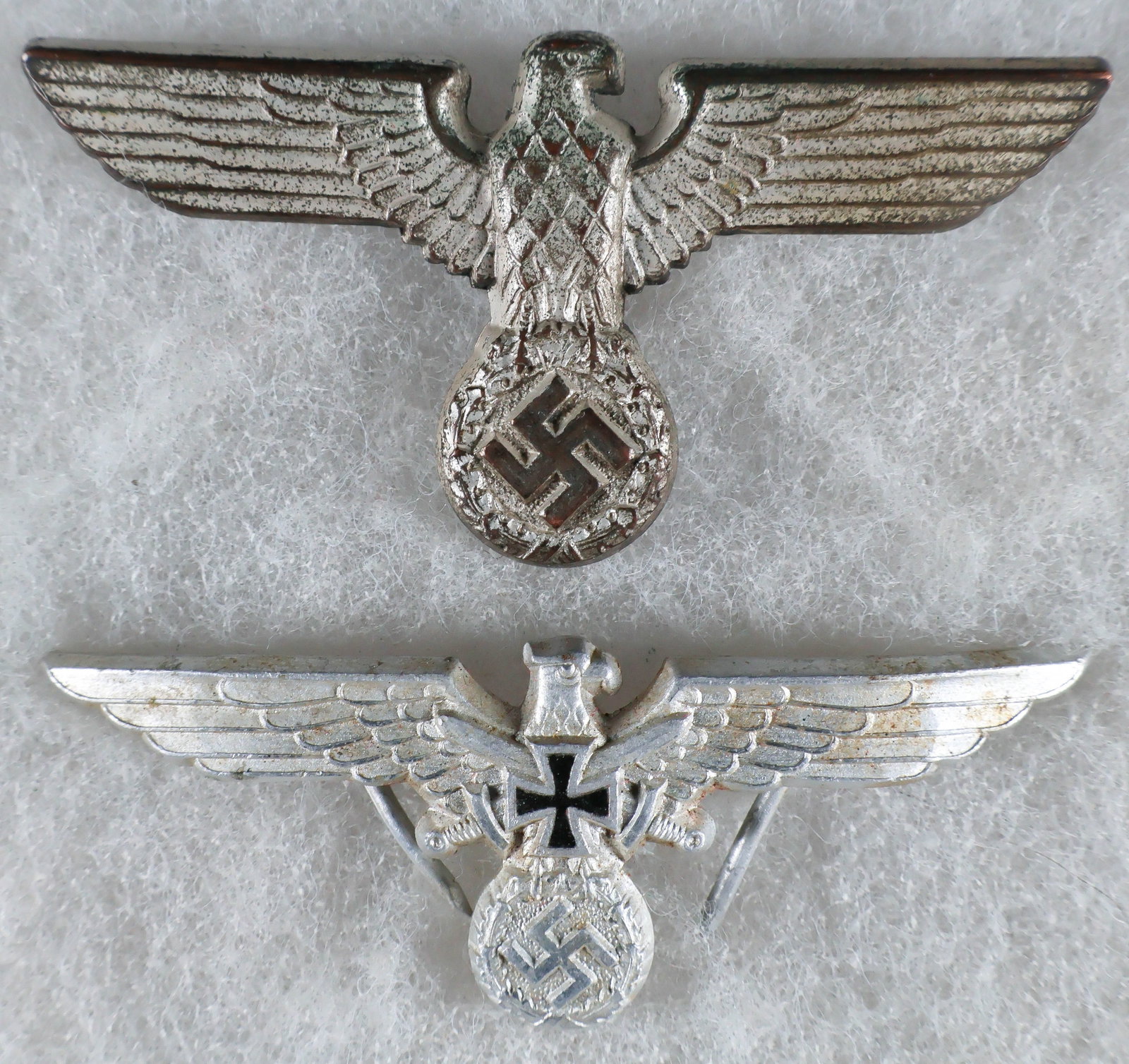 NSDAP AND KYFFHAUSERBUND VISOR CAP EAGLES: Good lot of two of Third Reich visor cap eagle badges, includes: 1936-pattern NSDAP political visor cap eagle, approx. 2.5 x 1.25 in., die-stamped from nickel silver and with a silver-wash finish. The