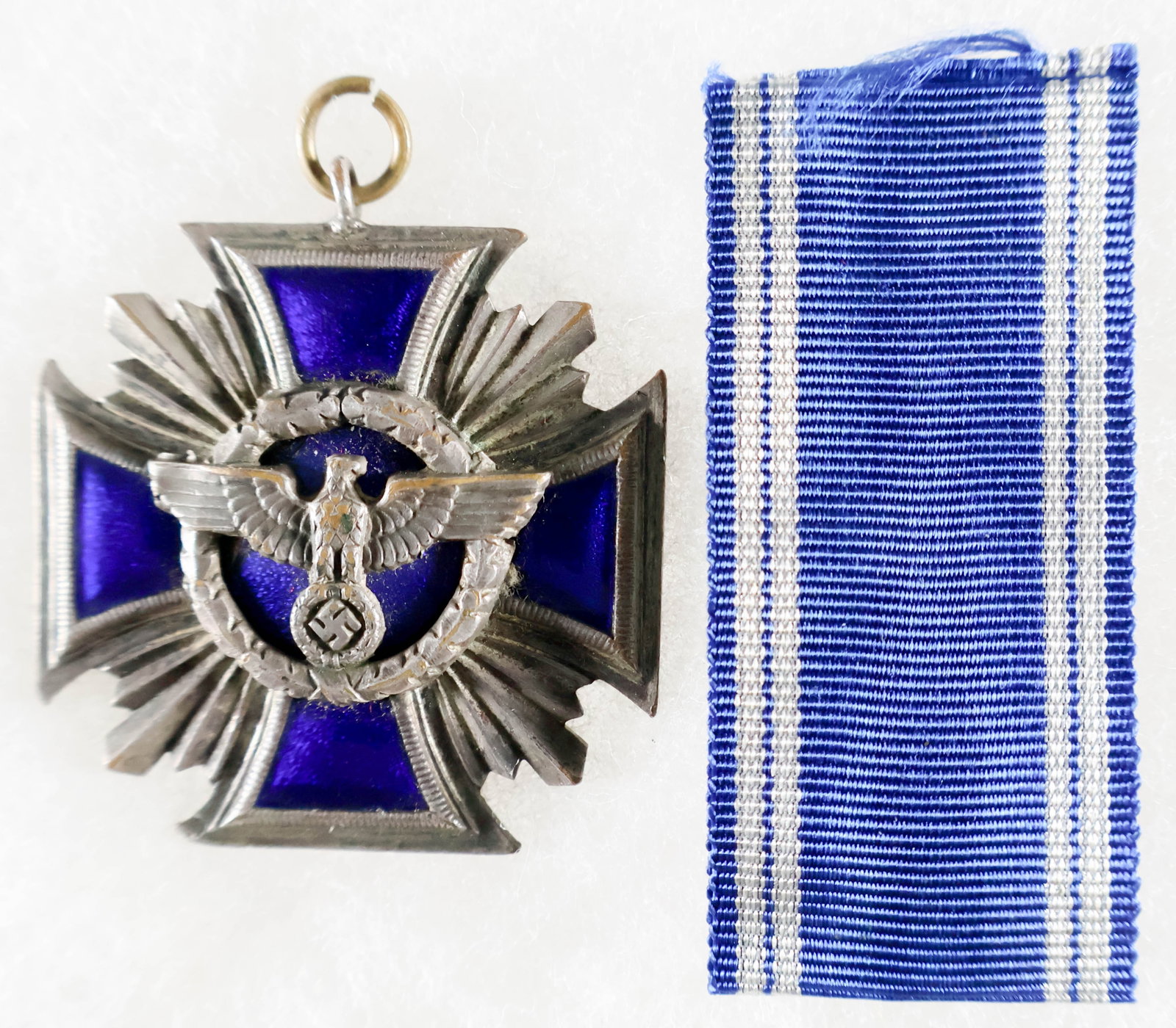 NSDAP LONG SERVICE AWARD, 2ND CLASS: Nazi Party Long Service Award, 2nd Class (15 Years). On the reverse side, the award reads: German: 'Loyalty to Leader and People' The award is a four-pointed cross with slightly curved arms. In the ce