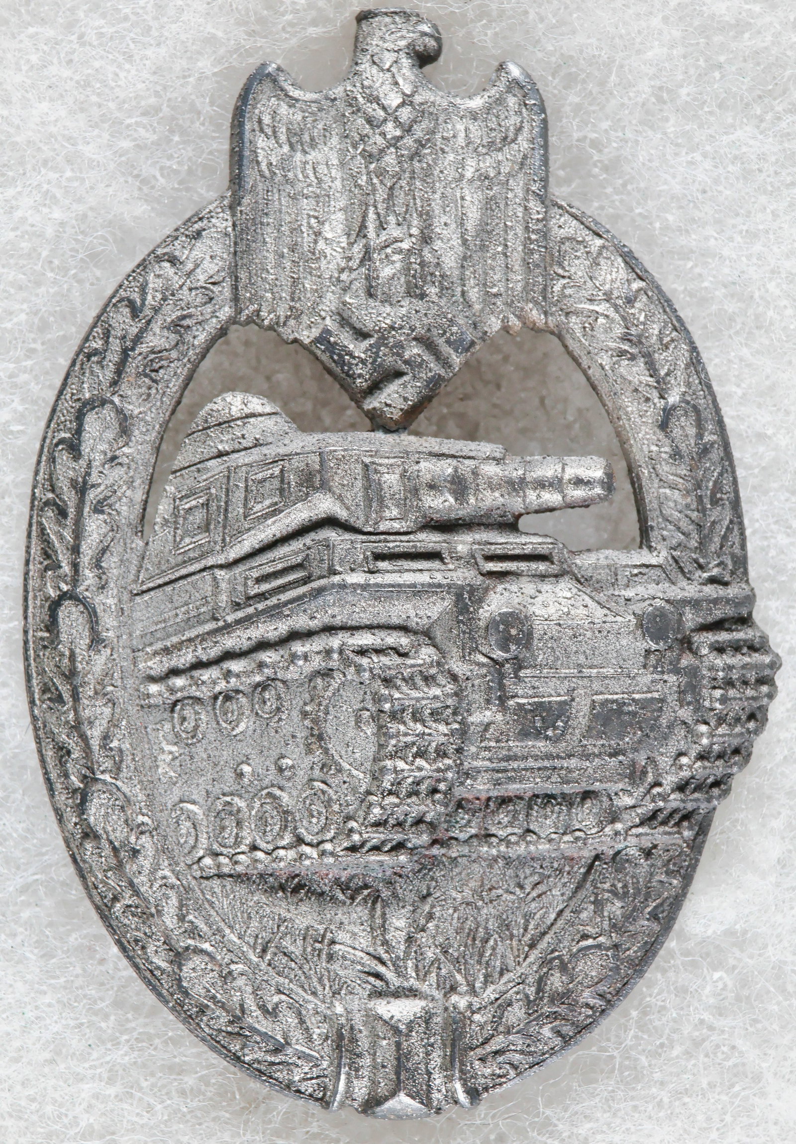 PANZER ASSAULT BADGE IN SILVER BY ADOLF SCHOLZE: A Third Reich ‘Panzerkampfabzeichen in Silber’ (‘Panzer Assault Badgein Silver’), approx. 1.15 x 2.25 in., awarded to panzer personnel who saw combat in three armored assaults.