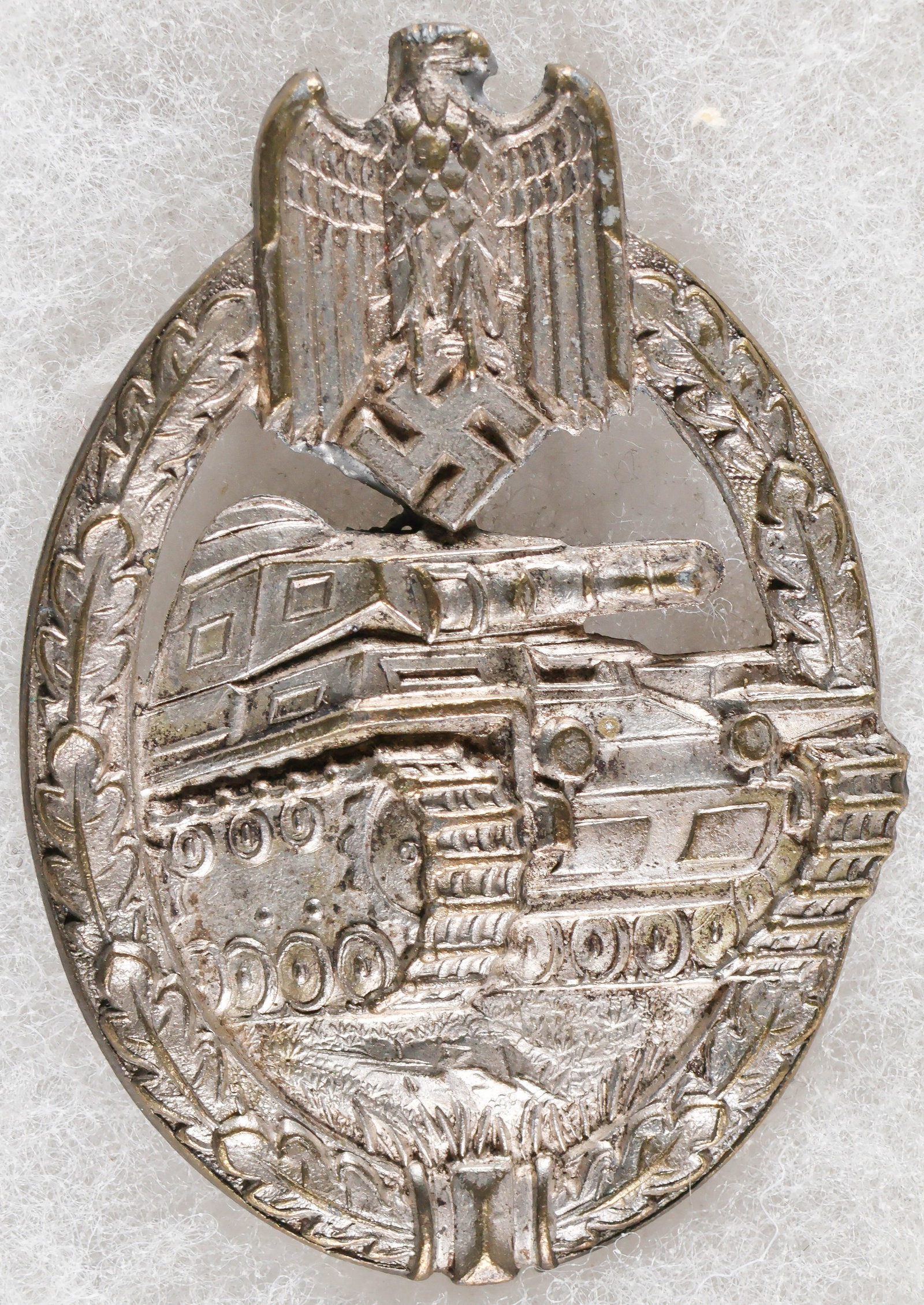PANZER ASSAULT BADGE IN SILVER BY KARL WURSTER: A Third Reich ‘Panzerkampfabzeichen in Silber’ (‘Panzer Assault Badgein Silver’), approx. 1.15 x 2.25 in., awarded to panzer personnel who saw combat in three armored
