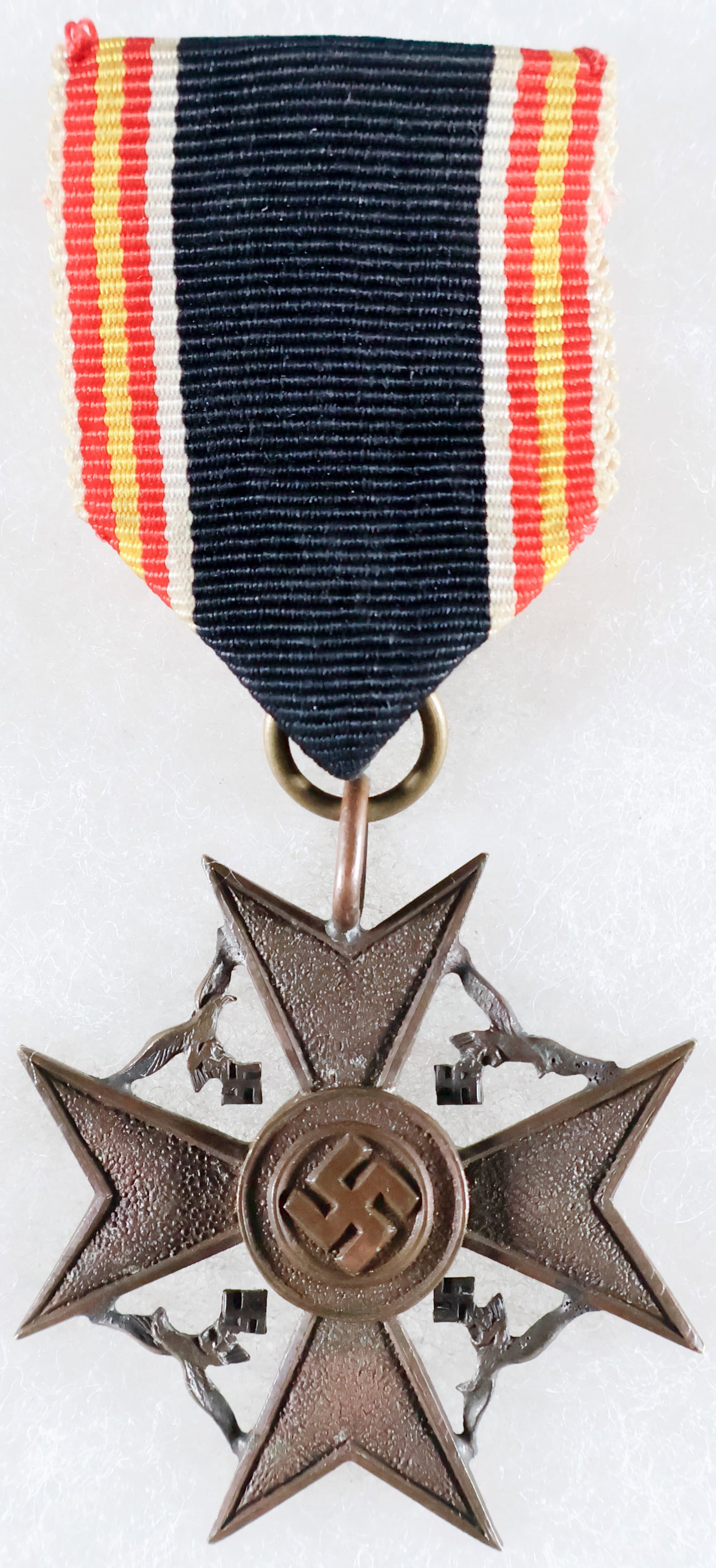 SPANISH CROSS FOR NEXT OF KIN: Exceedingly rare Spanish Cross of Honor, also known as the Spanish Cross for Next of Kin, bronze construction, 1 9/16 in. wide, resembling a Spanish Cross but on a smaller scale. The eagles between ea
