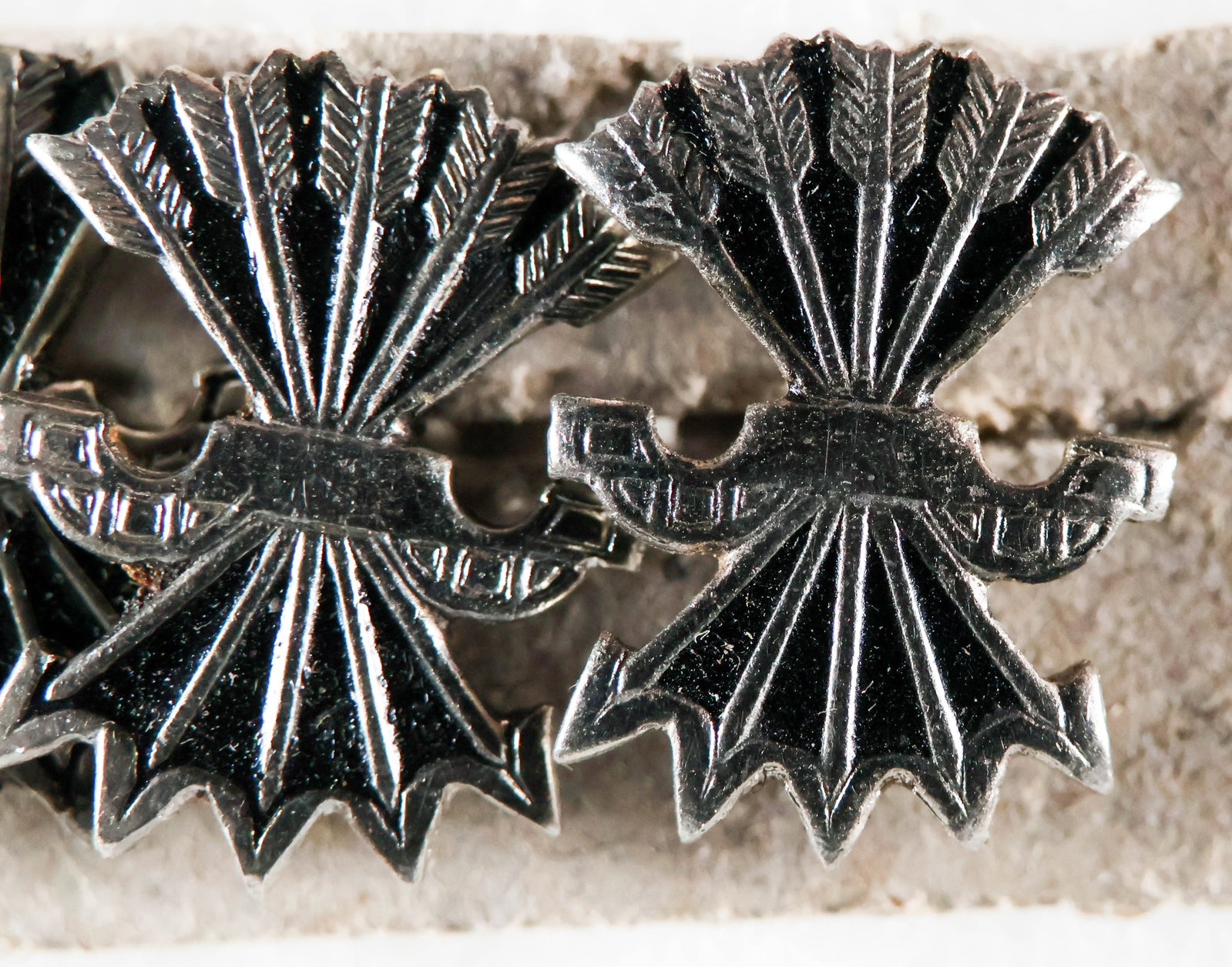SPANISH FALANGE PARTY PINS (15): Lot of 15 unissued Falange Party Membership badges as issued to by the Franco's Nationalist forces during the Spanish Civil War and by the Blue Division on the Eastern Front, buttonhole lapel type