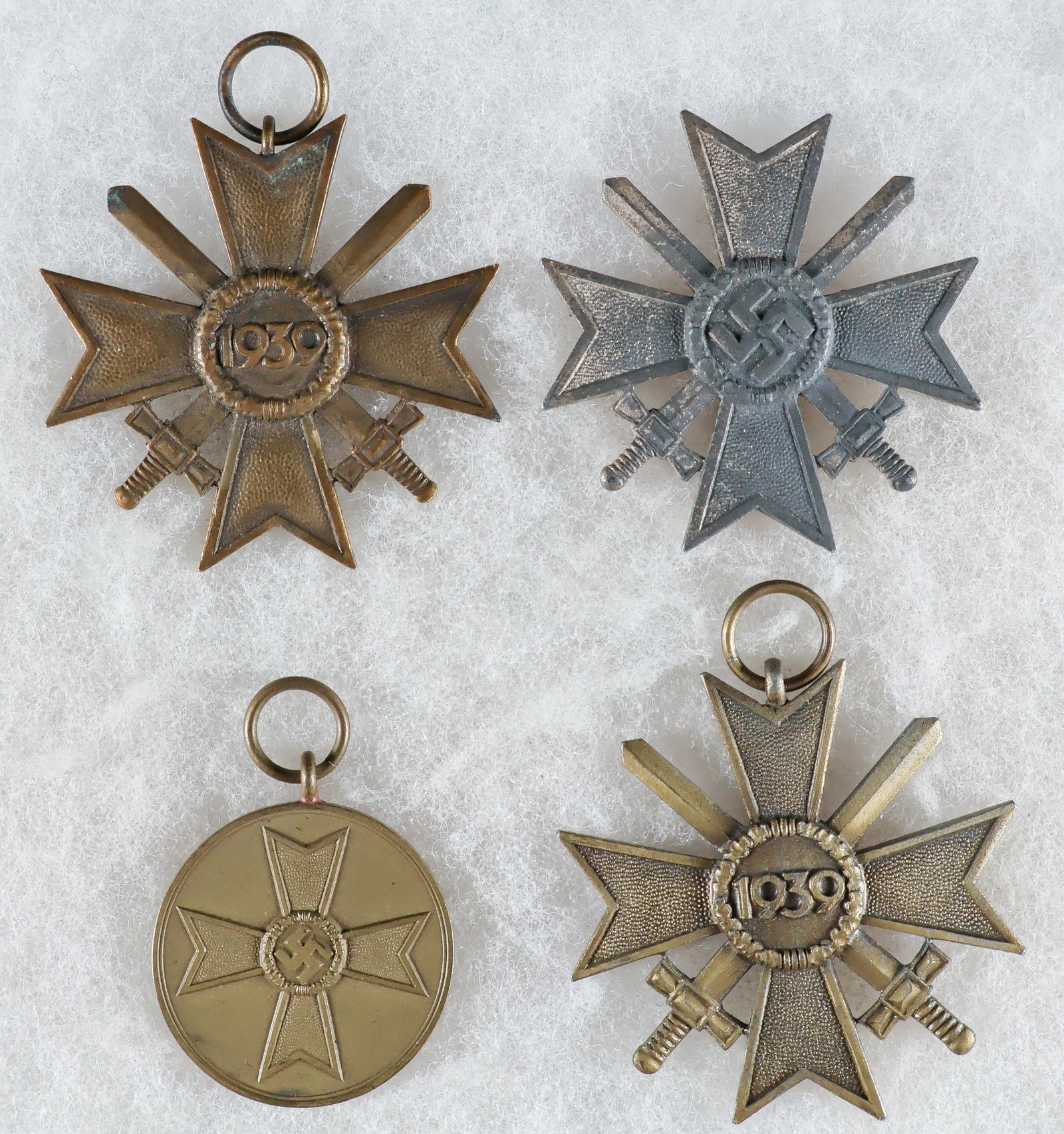 WAR MERIT CROSS WITH SWORDS, FIRST AND SECOND CLASSES, WITH WAR MERIT MEDAL (4): Good lot of three War Merit Cross medals, each approx. 1.75 in. square, including one pinback First Class example, maker-marked ‘3’ on the reverse, and two Second Class, one marked ‘