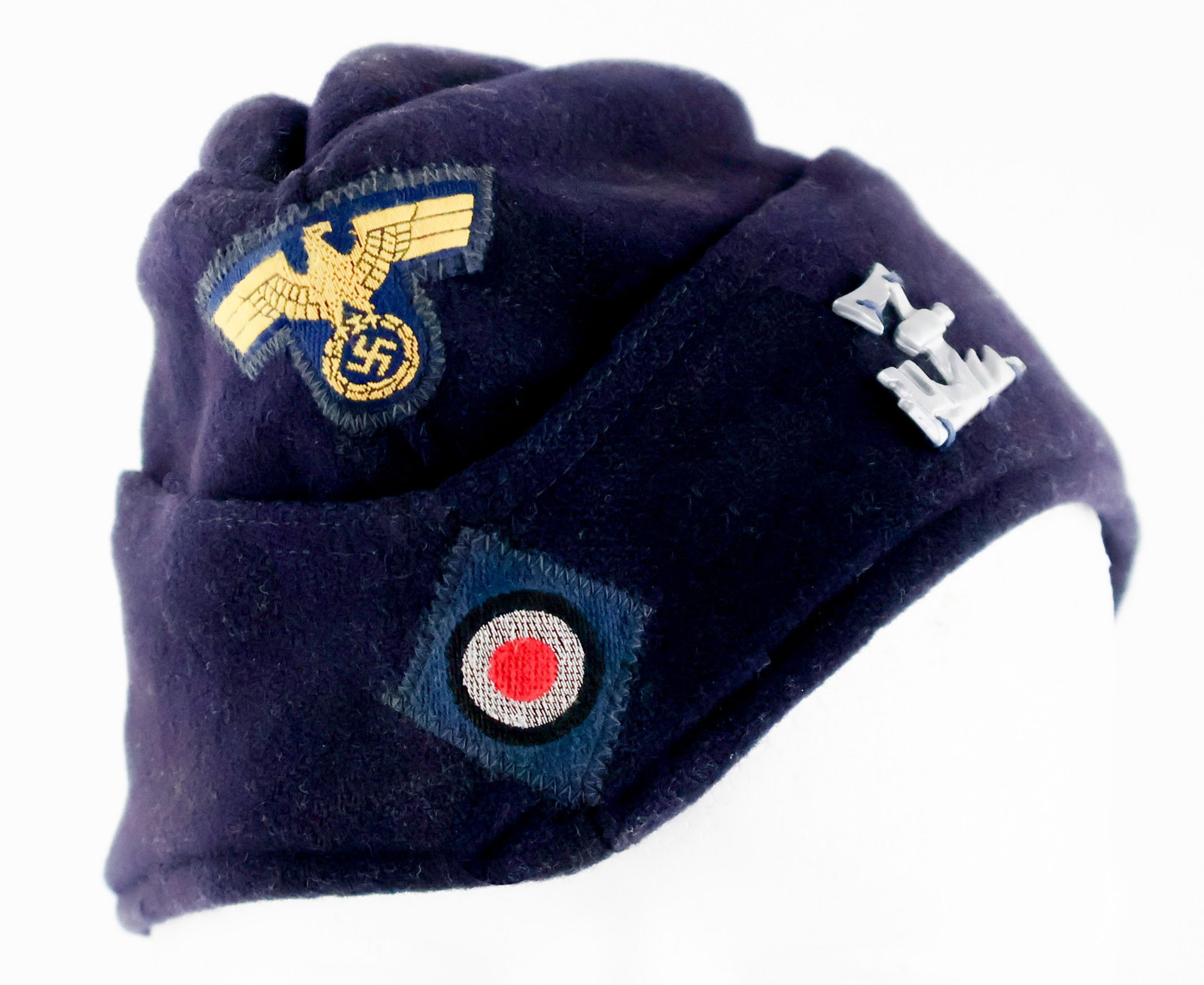 GERMAN U-BOAT OVERSEAS CAP: A very well-preserved German U-boat overseas cap with the insignia for U-777 and U-3039, as the submarine commander and crew from the U-777 received a new boat, the U-3039. This navy blue wool cap bea
