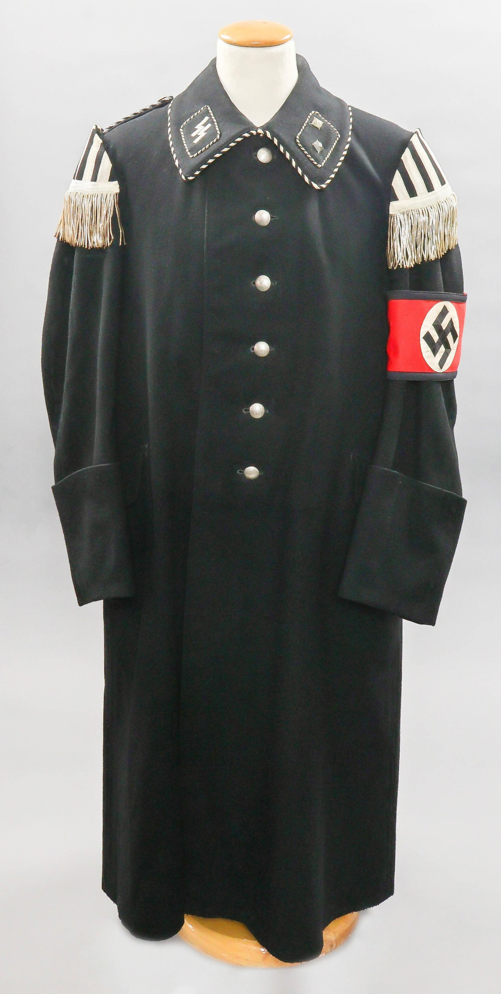 THIRD REICH ALLGEMEINE-SS MUSICIAN'S OVERCOAT: An extremely rare example of the early Allgemeine-SS overcoat, showing collar tabs in the rank of Truppfuhrer (SS-Troop Leader) and in this case issued to a musician. This Allgemeine-SS overcoat is co
