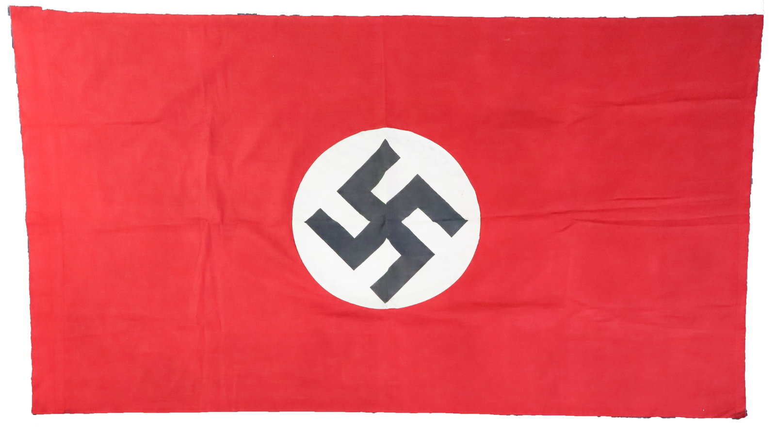NAZI PARTY BANNER: A 44 x 29.5 in. Nazi party banner made of red-dyed cotton with a small sewn swastika on a white field. It has a large pole pocket on the hoist. Lightly stained, otherwise fine.