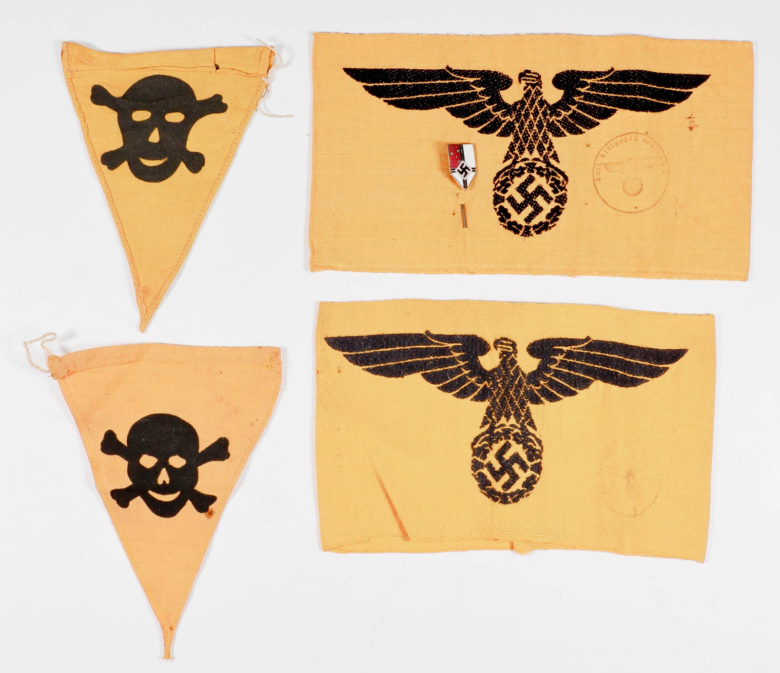 WEHRMACHT CIVILIAN SERVICE ARMBANDS, STICK PIN AND MINE FLAGS: Good lot of five pieces of Third Reich insignia, includes: two yellow cotton embroidered armbands for civilians in Wehrmacht service, both stamped; two printed yellow cloth mine warning pennants, and