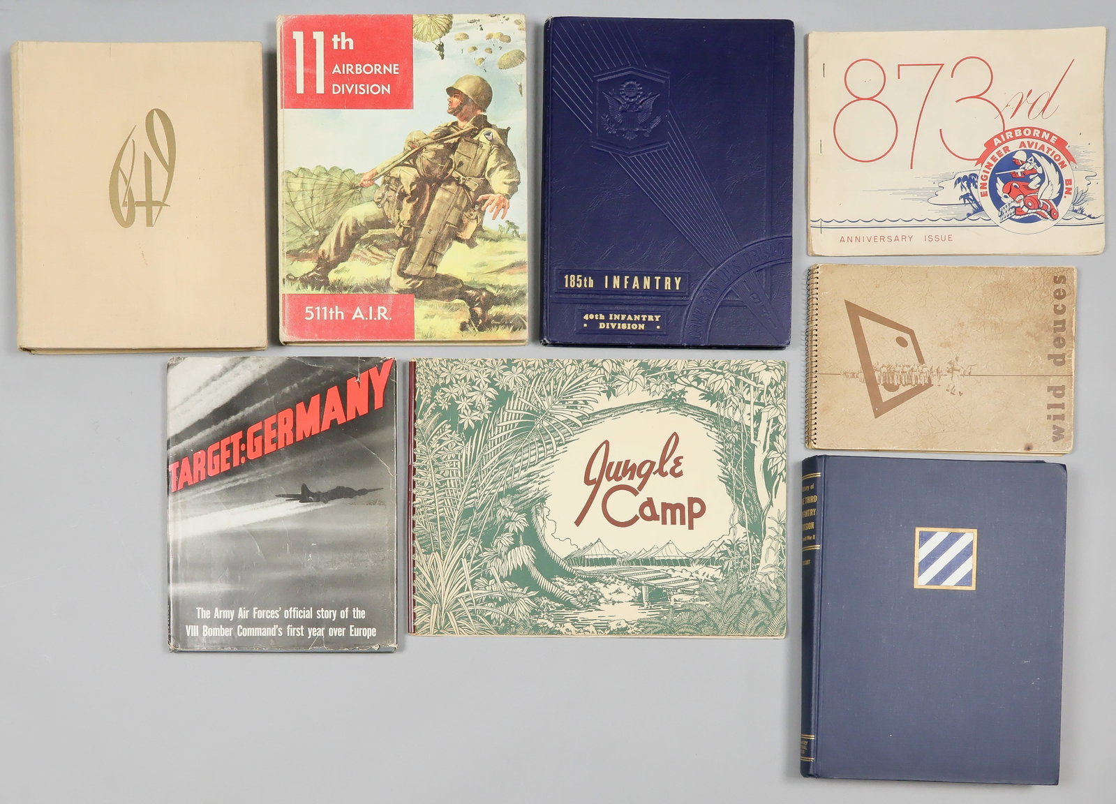 AMERICAN MILITARY UNIT HISTORIES AND RETROSPECTIVES (8): Good mixed lot of eight American military unit histories, retrospectives, etc. includes: 'Target: Germany', Simon & Schuster, 1943; 'Jungle Camp', 33rd Division, ca. 1945; '649th Engineer Battalion', 