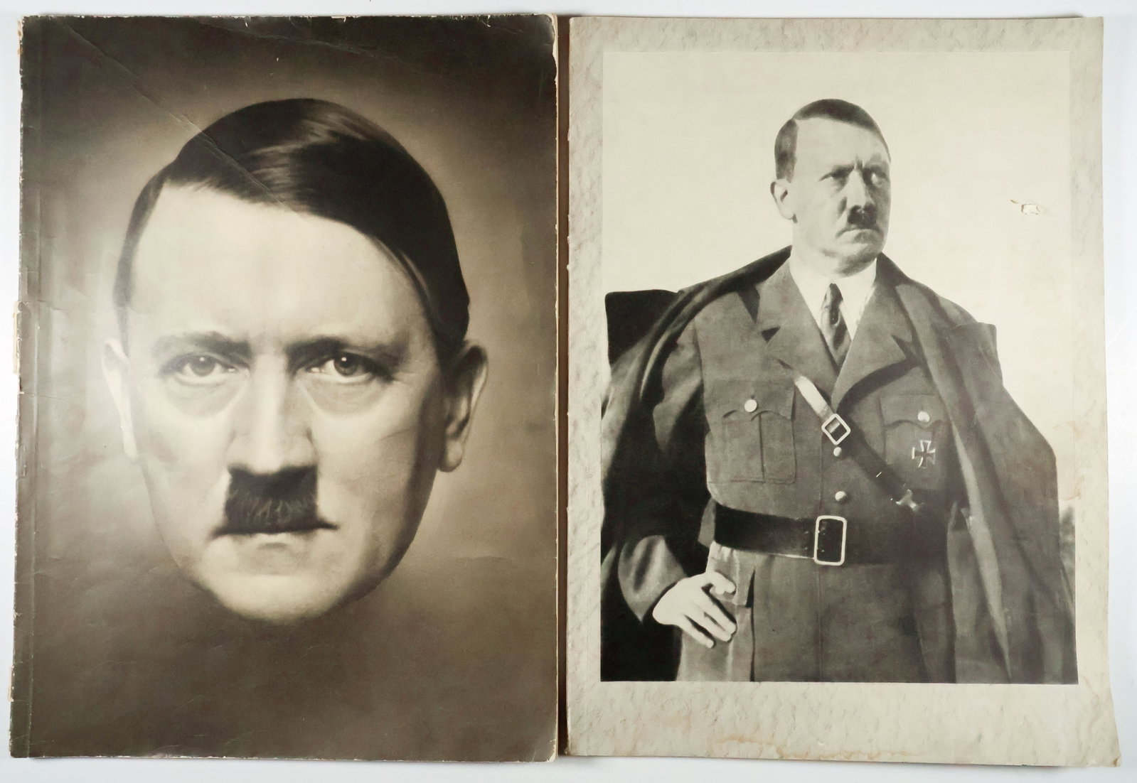 GERMAN PROPAGANDA BOOKS (2): Pair of large format German propaganda magazines. Includes: large illustrated book 'Das Deutschland Adolf Hitlers', 128pp. 10.5 x 14 in., published in 1937 by Verlag Franz Eher, the publishing house o