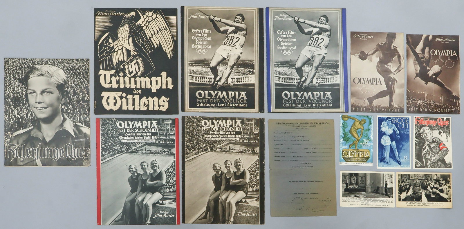 NAZI FILM (14): A group of 14 pieces related to German film, includes a postcard of 'Knock Out' featuring boxer Max Schmeling, programs for films about the 1936 Olympics, Hitler Youth, ‘Triumph of the