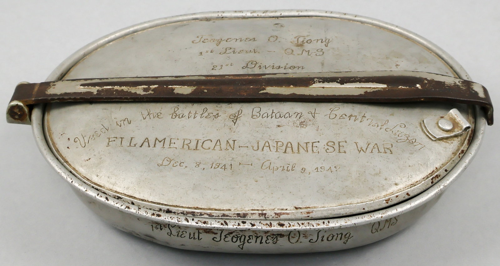 'BATAAN DEATH MARCH' SURVIVOR'S MESS KIT: An excellent relic, an aluminum combination mess kit and frying pan issued to a Filipino soldier serving in the U.S. 21st Infantry Division (Philippines). The division was one of the main combat