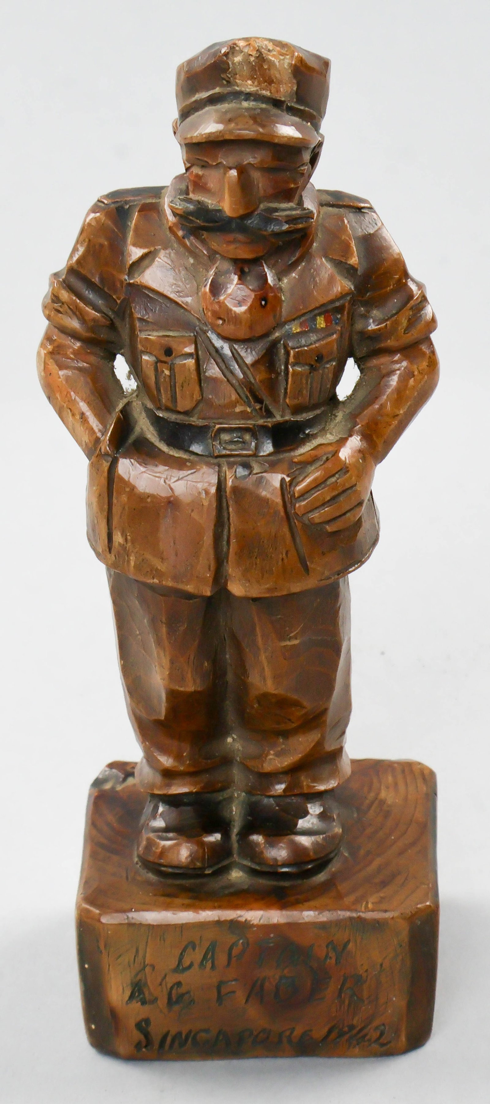 BURMA RAILWAY P.O.W. RELIC: An interesting wooden statue made by a British prisoner of war in Burma, Fredrick Fox, depicting Captain A.G. Faber, a Japanese POW and forced laborer for the Burma Railway, as part of 'U Party' led