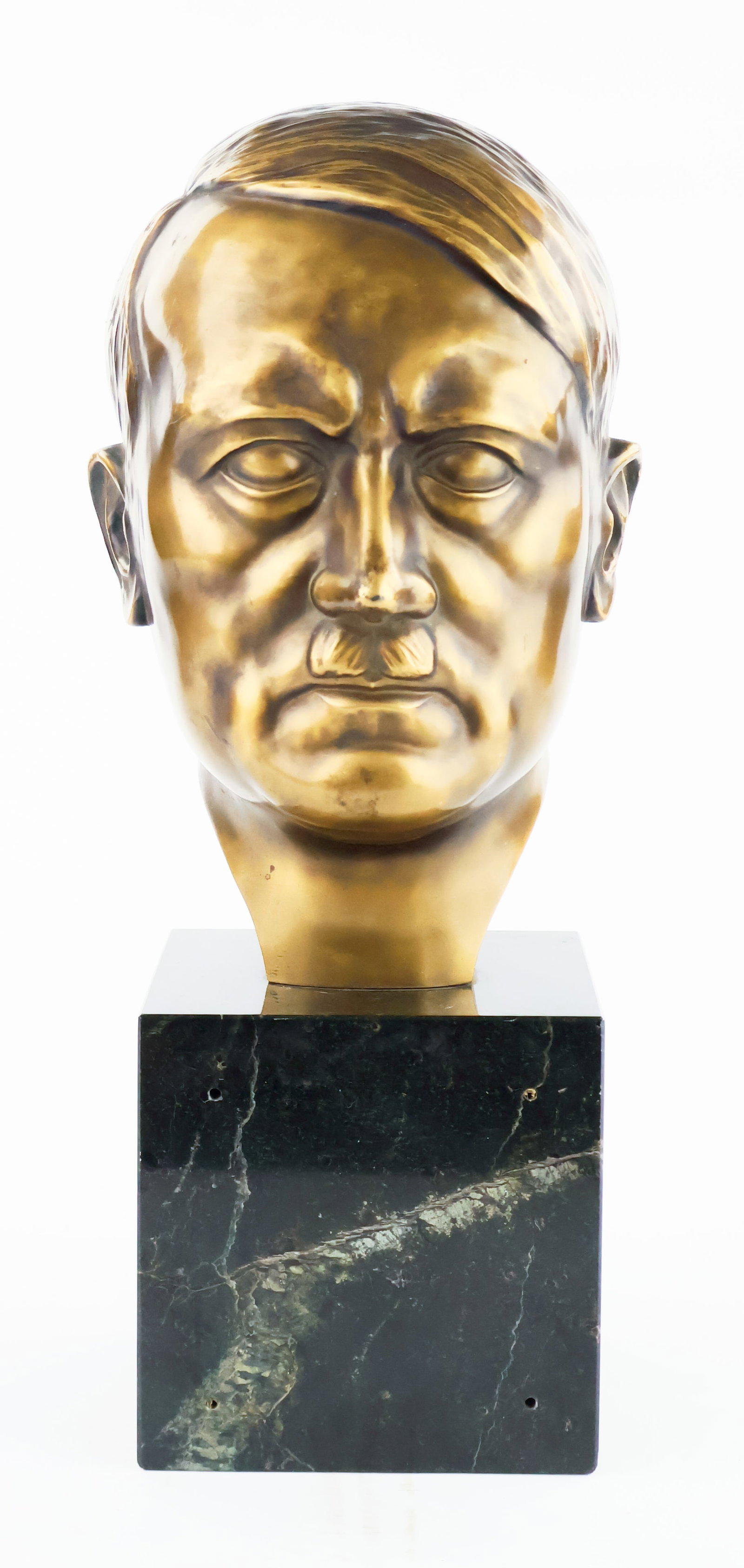 ADOLF HITLER BRASS-COATED BUST: A well-made brass-plated bust of Adolf Hitler, 12.75 x 5.5 x 6.75 in., with the sculptor’s signature on the back of the neck, 'SCHONMANN’, likely the artist ERWIN SCHONMANN (1906-1999). Th