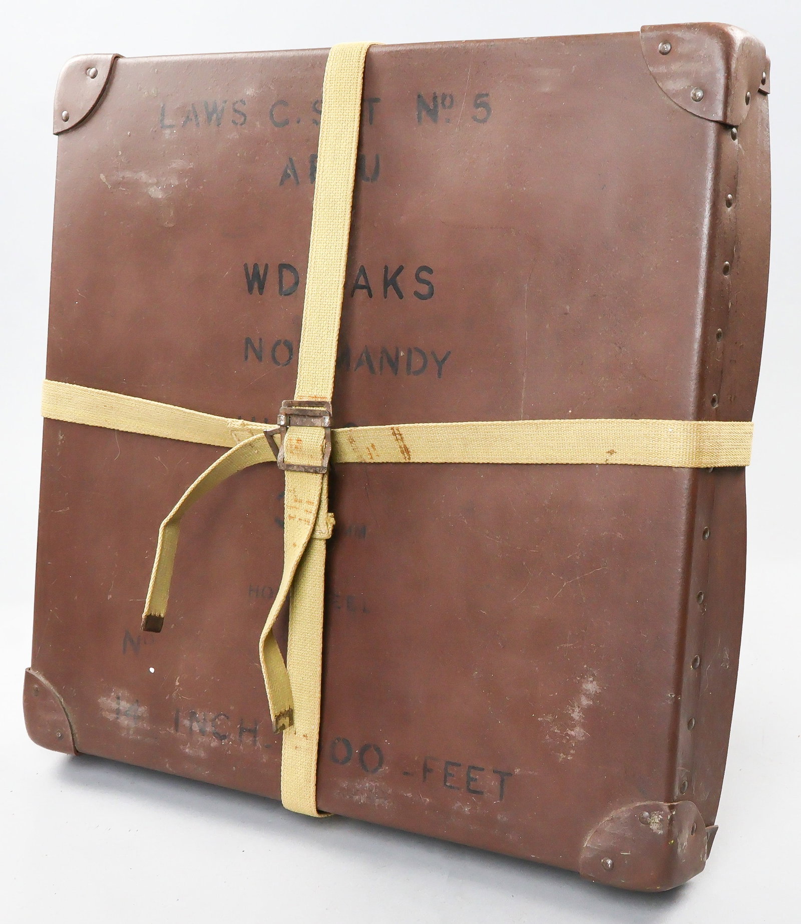 AFPU NORMANDY FILM CASE: An Army Film and Photographic Unit 35mm film case (empty) measuring 15 in. square x 2 in. high, stenciled on the lid: ‘Laws C. Sct. No. 5 AFPU WD…AKS Normandy June 6 1944 35mm Home Reel