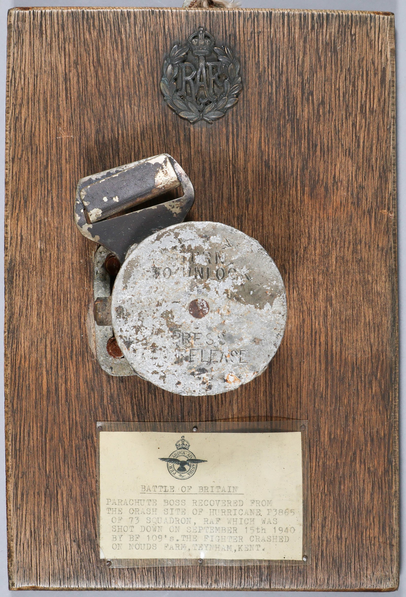 BATTLE OF BRITAIN PARACHUTE BOSS RELIC: A parachute quick-release box or ‘boss’ from Hurricane P3865 in the 73rd Squadron Debden, piloted by R. A. Marchand. Marchand was shot-down in combat over Maidstone on Sept. 15, 1940 on