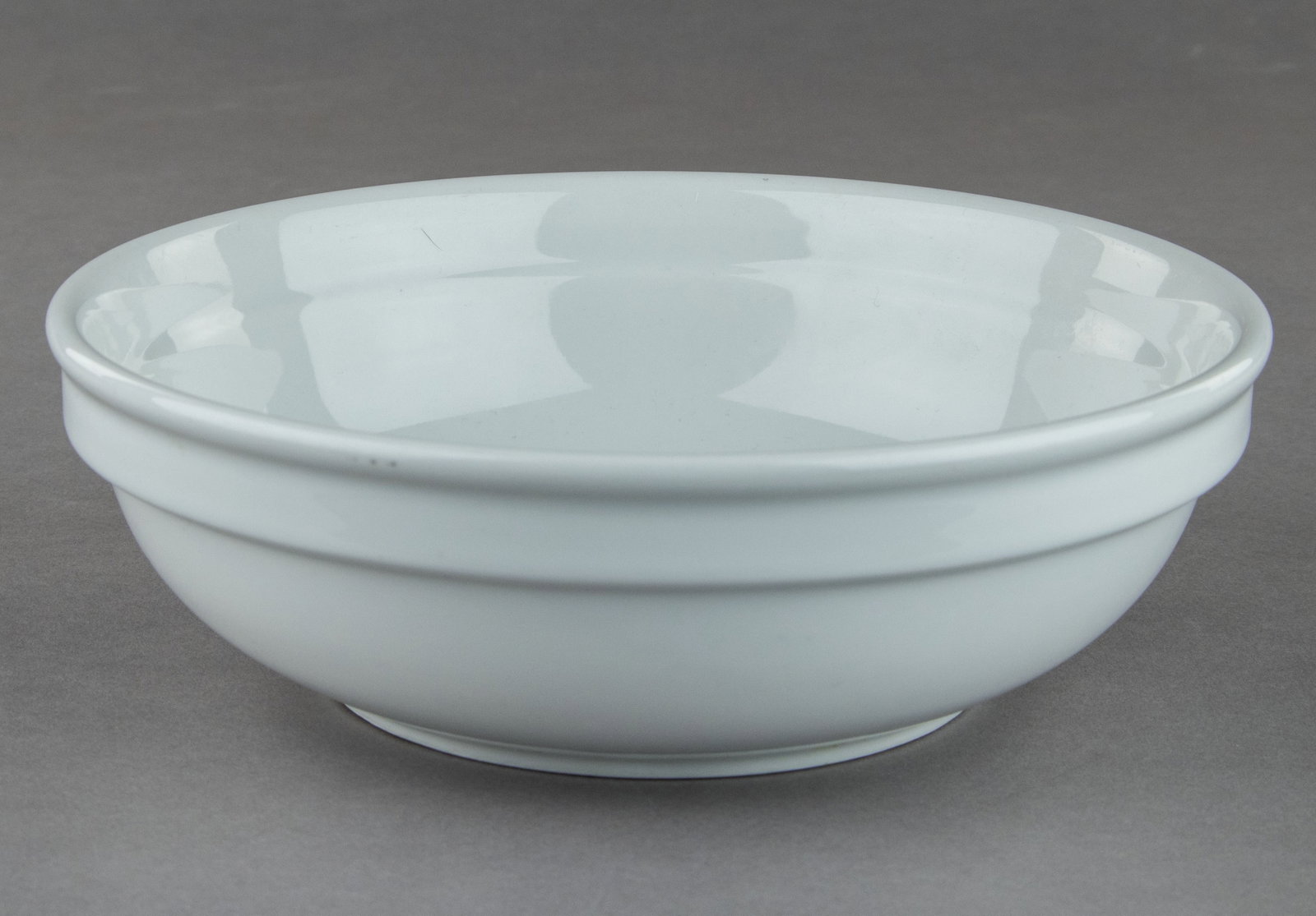 D.A.F. ‘BEAUTY OF LABOR’ PORCELAIN SOUP BOWL: A fine German made porcelain soup bowl, 8.5 in. dia. and 3 in. deep. The bottom displays the insignia of the DAF (‘German Labor Front’) suborganization Schonheit der Arbeit ('Beauty of