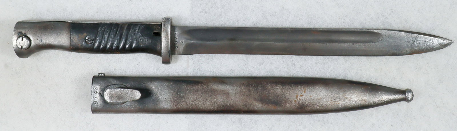 GERMAN K98 RELIC BAYONET: German K98 bayonet with scabbard, both in relic condition. This bayonet had at one point been extremely rusted and oxidized, but showing no physical flaws, and now has been cleaned and sharpened.