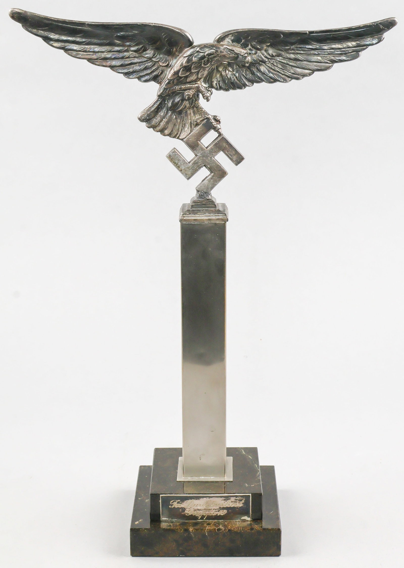 LUFTWAFFE DESK EAGLE: Period example of a presentation desk eagle for a member of the Luftwaffe, standing 14 in. tall overall, the eagle itself is 4.25 in. tall (including swastika), with a wingspan that is approximately