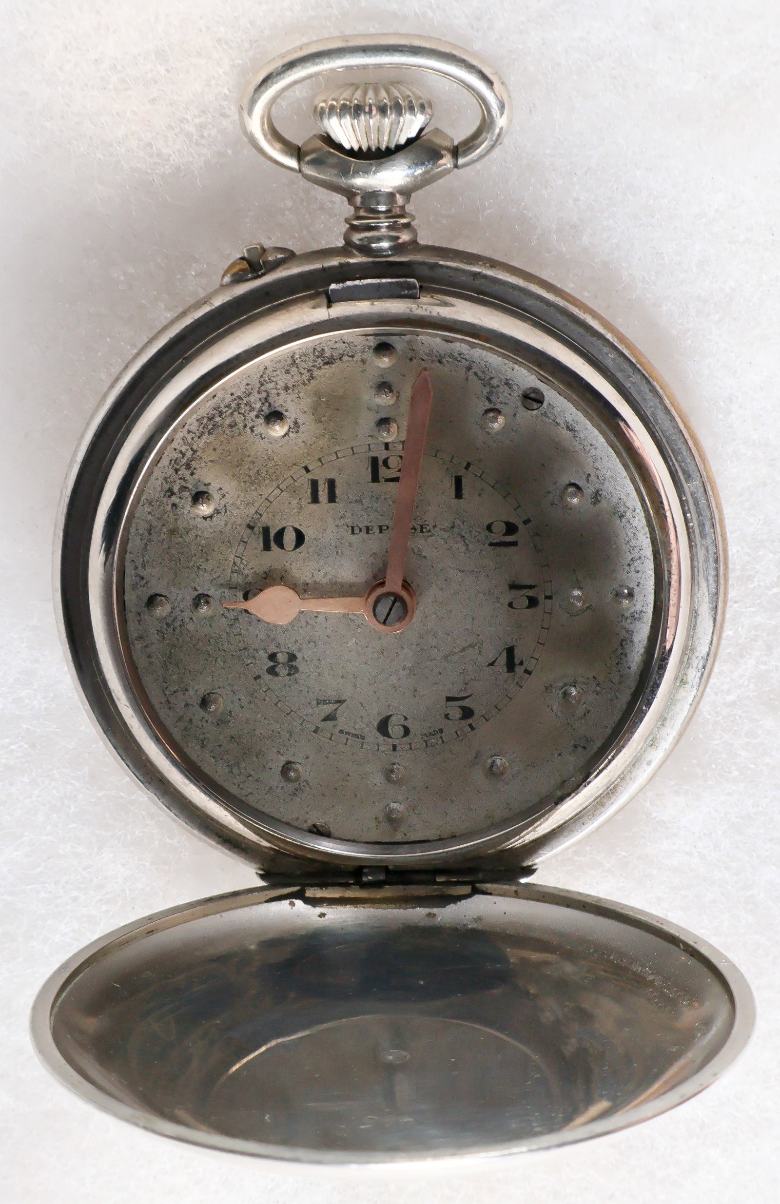 NSDAP INSCRIBED ‘BLIND MAN’S' SWISS POCKET WATCH: A ca. 1920s-1930s nickel Swiss pocket watch with case embellished with a stamped NSDAP eagle device and initials ‘RAM’, 53mm. approx., inner movement with pin-pallet escapement and gilt