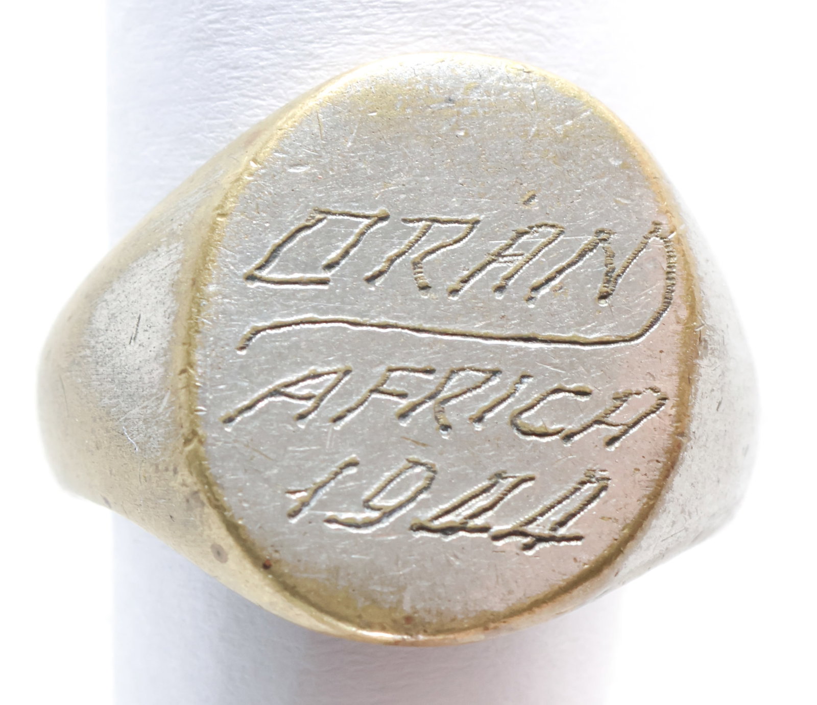 ORAN AFRICA RING: A gold-plated ring inscribed ‘ORAN AFRICA 1944’ with no marks of allegiance of the original owners. Oran was a major Mediterranean port which was used by the Allies in Operation Torch.