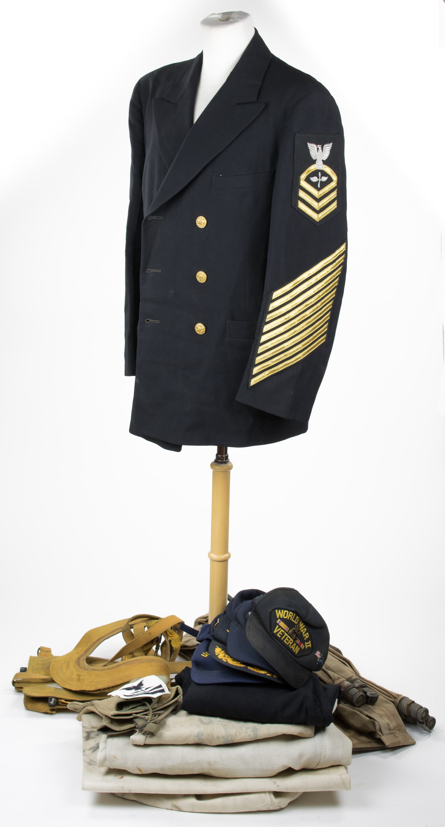 UNIFORM, MAP AND MEDAL GROUPING OF IWO JIMA AVIATOR AND USS BISMARCK SURVIVOR: An excellent grouping of material from U.S. Navy Aviation Machinist's Mate, First Class and Torpedo Bomber Gunner REGINALD H. FISCHER (1924-2021) who survived the sinking of the escort carrier CVE-95