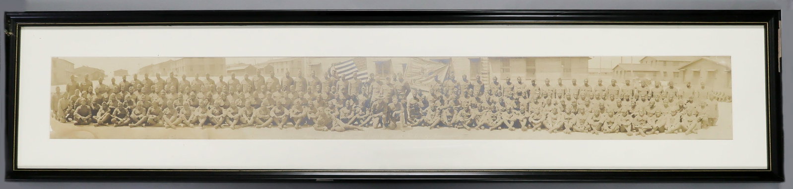 BLACK 806TH PIONEER INFANTRY COMPANY PHOTOGRAPH: Excellent original photograph showing the black troops and white officers of 'Co. C 106th Pioneer Infantry...' The 43 x 5.5 in. (sight) photograph shows the soldiers in four rows and in uniform,