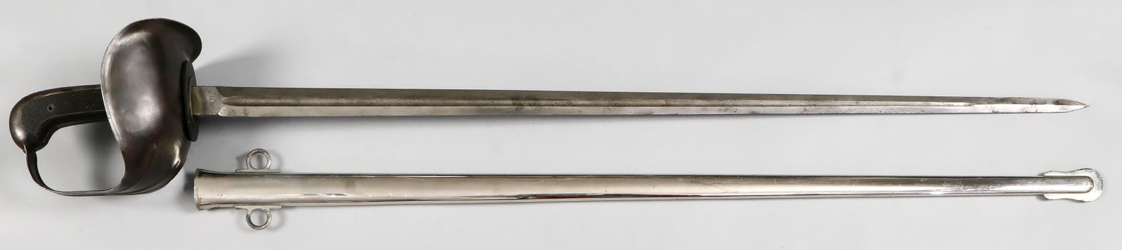 PATTON MODEL 1913 STRAIGHT SWORD BY L. F. & C.: Model 1913 cavalry sword commonly referred to as the 'Patton Saber,' designed for the U.S. Army by Second Lt. (later General) George S. Patton, Jr. in 1913. The sword has a large, basket-shaped hilt m