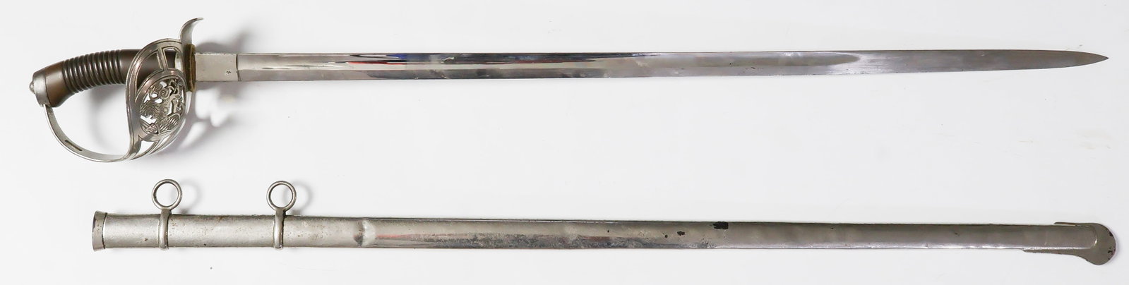 BAVARIAN M1889 CAVALRY OFFICER’S DRESS SWORD: An Imperial German M1889 Cavalry Officer’s dress sword, 31.5 in. blade, 36.75 in. overall, featuring a brightly-polished basket-style steel hilt depicting a Bavarian rampant lion with sword and 
