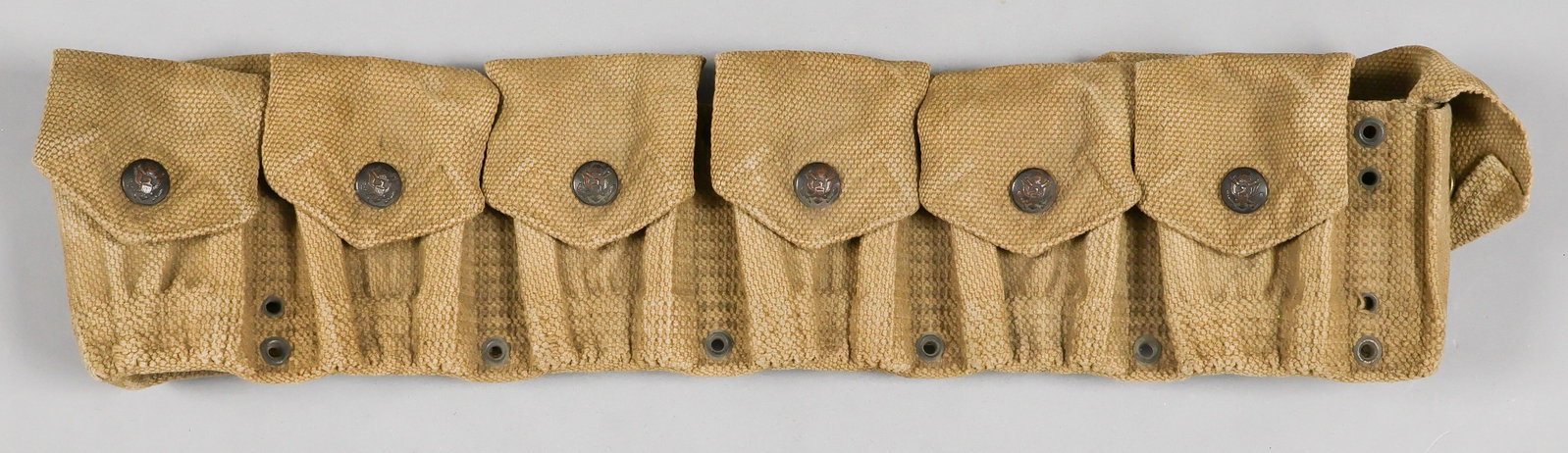 MILLS MODEL 1903 CARTRIDGE BELT: A pre-World War I Mills Model 1903 cartridge belt for the .30-06 ammunition used by the Springfield M1903 rifle, 39.5 x 4.25 in. (adjustable), constructed of khaki webbing and fitted with nine flap-co