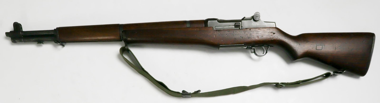 1945 U.S. M1 GARAND RIFLE BY SPRINGFIELD: Offered here is an original 1945 M1 Garand rifle, 43.5 in. long, semiautomatic, .30-06 caliber. Distinctly marked on the bottom of the semi-pistol grip with a circled serifed ‘P' as well as another 