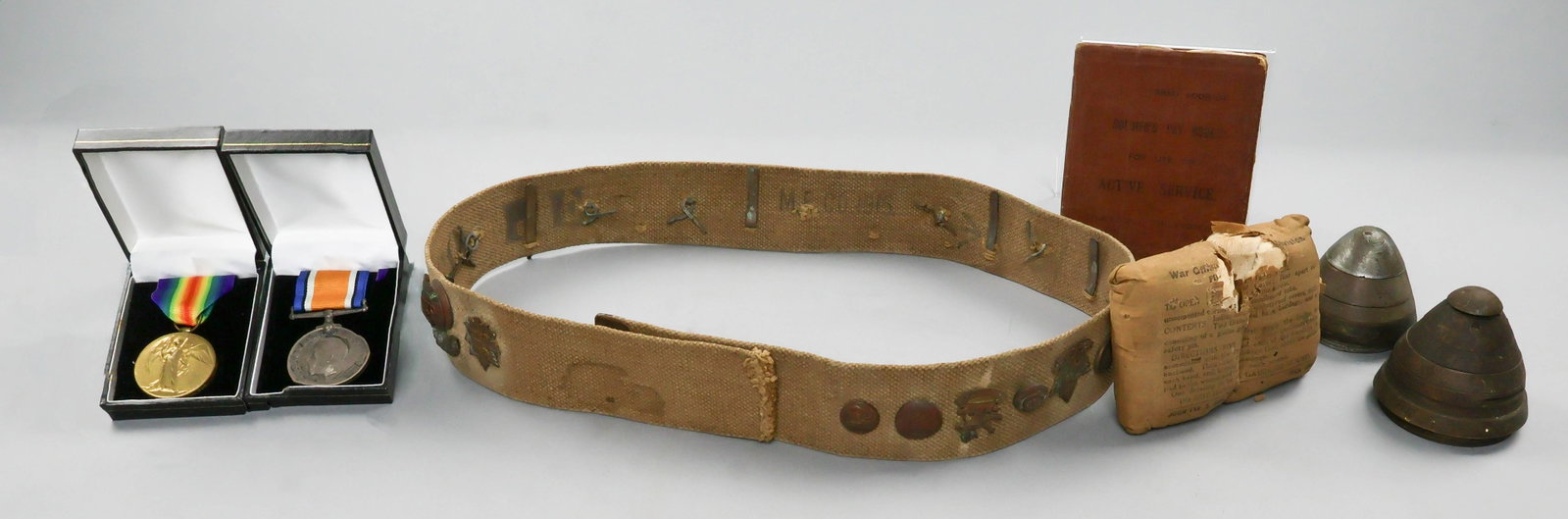 WORLD WAR I SOUVENIRS OF INTELLIGENCE OFFICER WITH 36TH ROYAL FUSILIERS: A fine group of seven items related to the service of Reinford A. Romanes (1896-1978), a German-speaking intelligence officer who fought with the 36th Battalion, Royal Fusiliers. Includes: Romanes'
