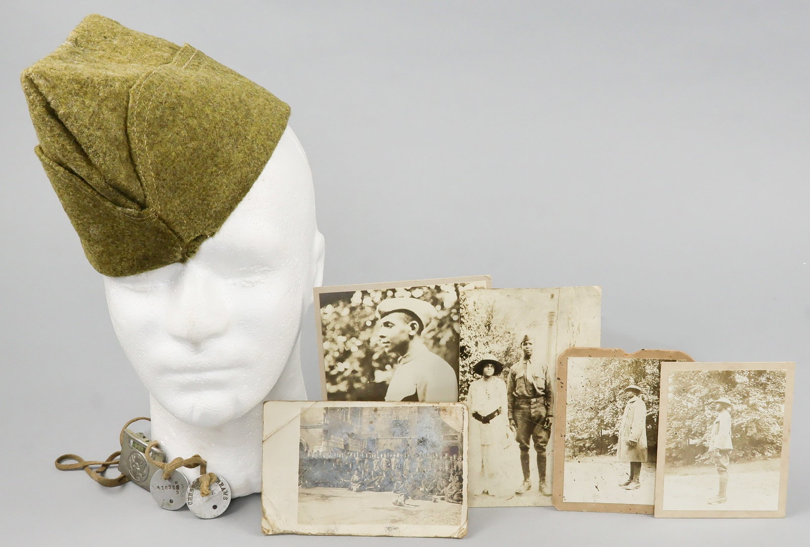 BLACK SOLDIERS DOG TAGS, GARRISON CAP, AND PHOTOGRAPHS (9): Excellent lot of nine items once belonging to black Pvt. Chester W. Abrams of Co. C, 546th Engineers Service Battalion which served in Europe during World War I, departing from New York on 25 Septembe