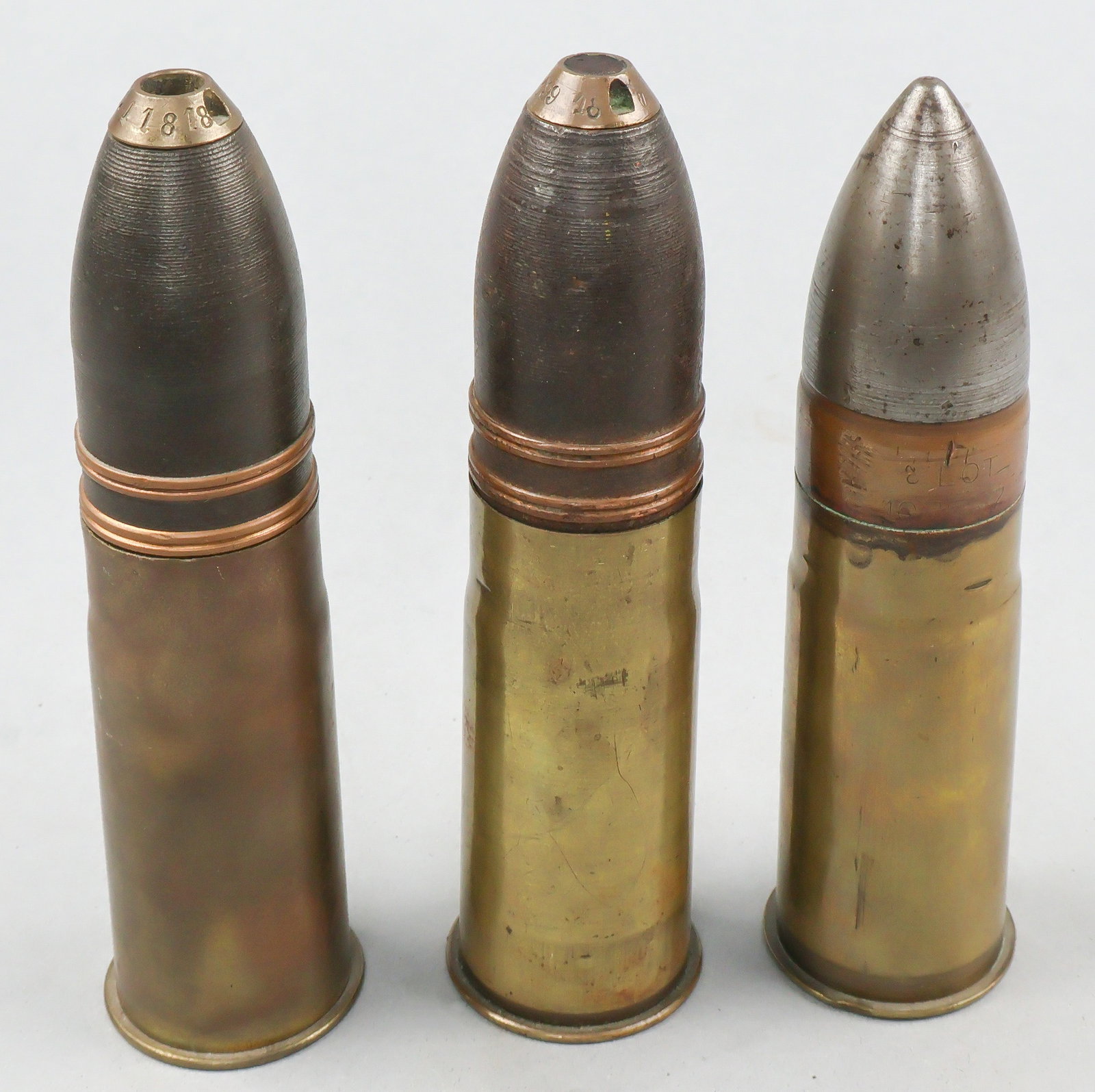 FRENCH AND U.S. 37MM MODEL 1916 ROUNDS (3): A good lot of three inert 37mm artillery rounds for the French 37mm Modele 1916 infantry support gun, also widely used by American forces during World War I, as well as other weapons such as the