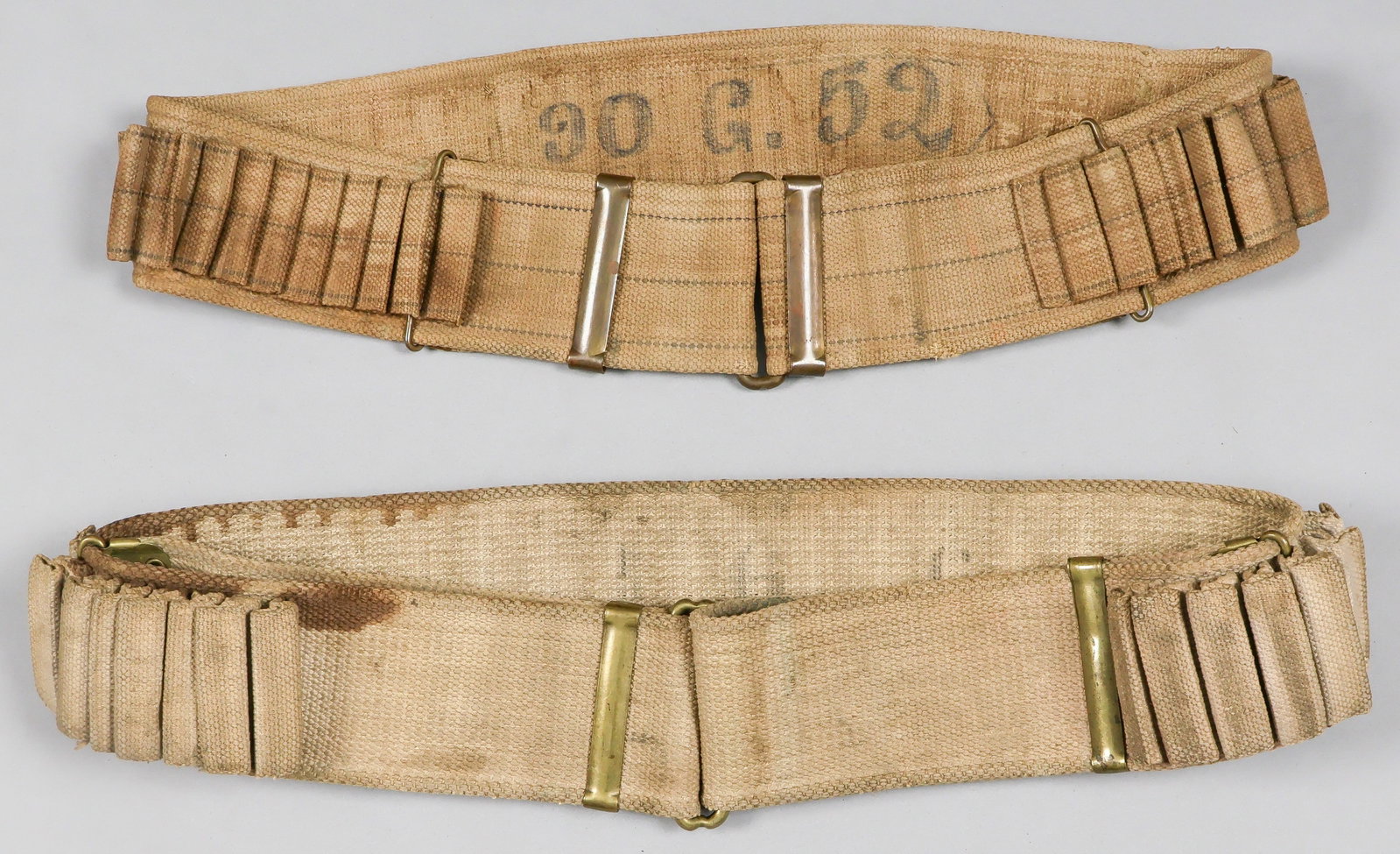 MILLS 1898 KRAG CARTRIDGE BELTS (2): Good pair of Mills-style cartridge belts for the .30-40 ammunition used by the U.S. M1898 Krag rifle, includes: a U.S. Model 1894 cartridge belt, 37 x 3 in. (adjustable), of khaki webbing with brass
