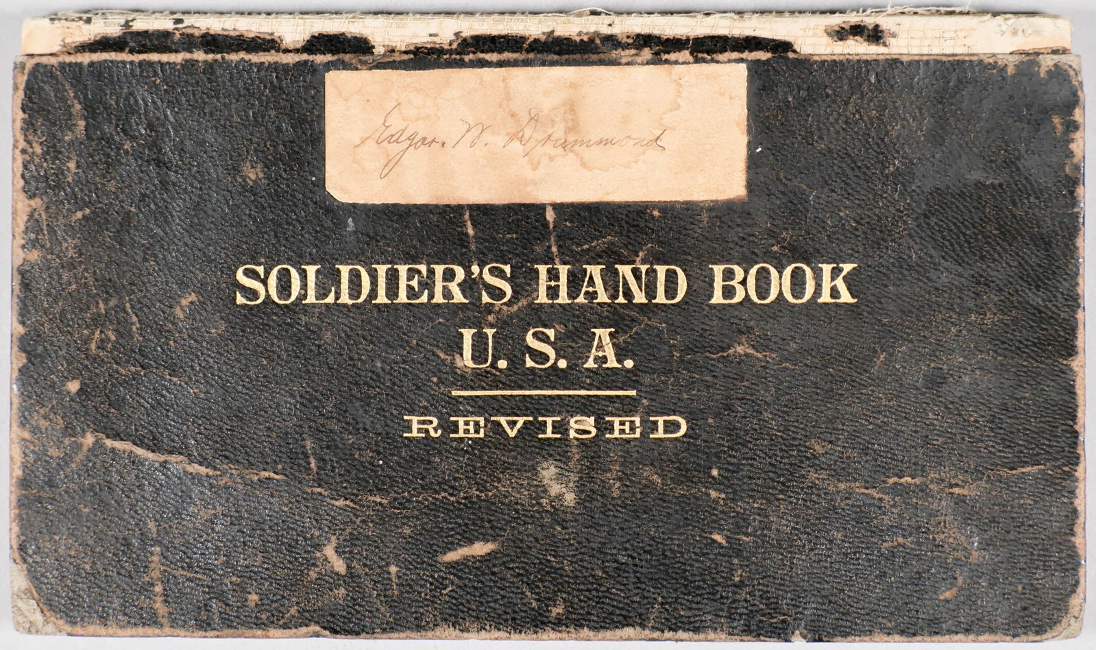 SPANISH-AMERICAN WAR SOLDIERS HANDBOOK: An original military publication, ‘Soldier’s Hand Book U.S.A. Revised’, 1898, 81pp. 6.5 x 4 in. hardbound in leather with gilt at cover, owned by Edgar W. Drummond, with his
