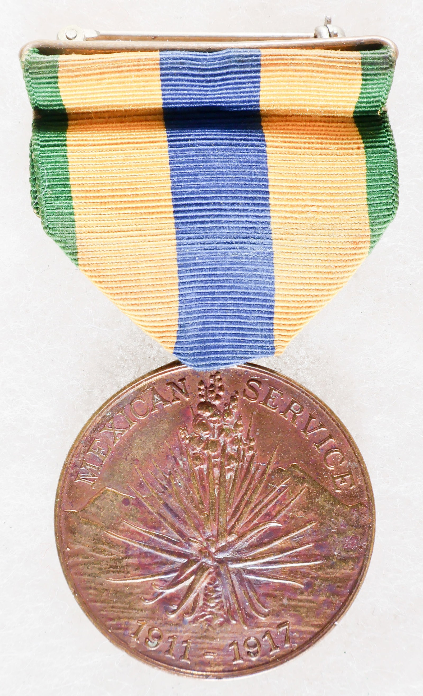 IDENTIFIED U.S. MEXICAN SERVICE MEDAL: U.S. Army Mexican Service Medal, awarded to personnel who participated in combat operations against Mexican forces between 1911 and 1919. The obverse of the medal depicts a yucca plant against a mount
